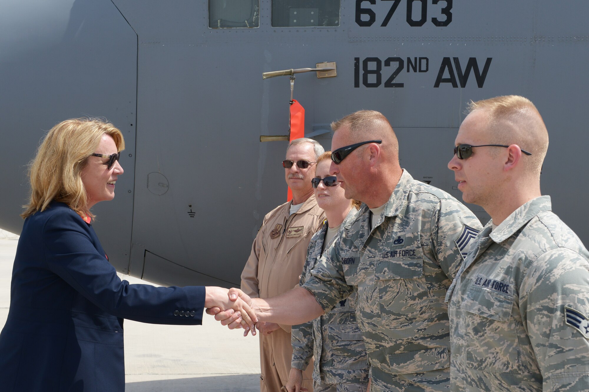 Secretary of the Air Force Deborah Lee James shakes hands with Chief Master Sgt. David Eschborn as she meets members of the 746th Expeditionary Airlift Squadron at Al Udeid Air Base, Qatar, Mar. 19, 2014. James and other senior leaders visited flying units assigned to 379th Air Expeditionary Wing and learned about their mission in support of Operation Enduring Freedom. This was James first visit to AUAB and she also held an all call to talk to Airmen about her three priorities for the Air Force: taking care of people, balancing readiness of today with readiness of tomorrow and making every dollar count. Eschborn is the 746th Aircraft Maintenance Unit NCO in charge deployed from Niagara Falls Air Reserve Station, N.Y., and a Buffalo, N.Y., native. (U.S. Air Force photo/Master Sgt. David Miller)