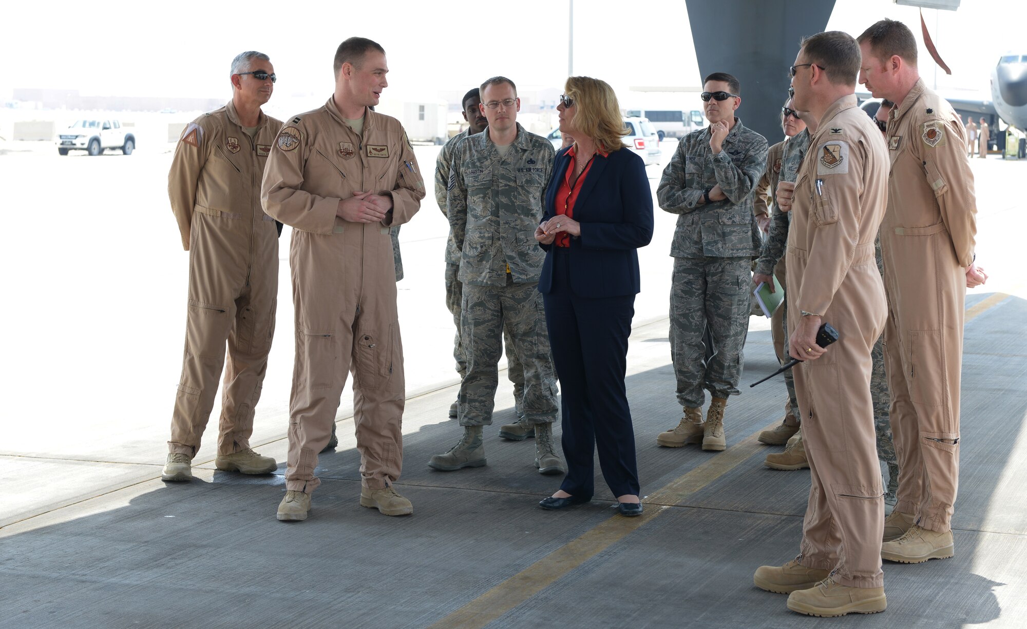 Members of the 37th Expeditionary Bomb Squadron brief Secretary of the Air Force Deborah Lee James on the capabilities of the B1-B Lancer at Al Udeid Air Base, Qatar, Mar. 19, 2014. James and other senior leaders visited flying units assigned to the 379th Air Expeditionary Wing and learned how they support Operation Enduring Freedom. This was James first visit to AUAB and she also held an all call to talk to Airmen about her three priorities for the Air Force: taking care of people, balancing readiness of today with readiness of tomorrow and making every dollar count. (U.S. Air Force photo/Master Sgt. David Miller)