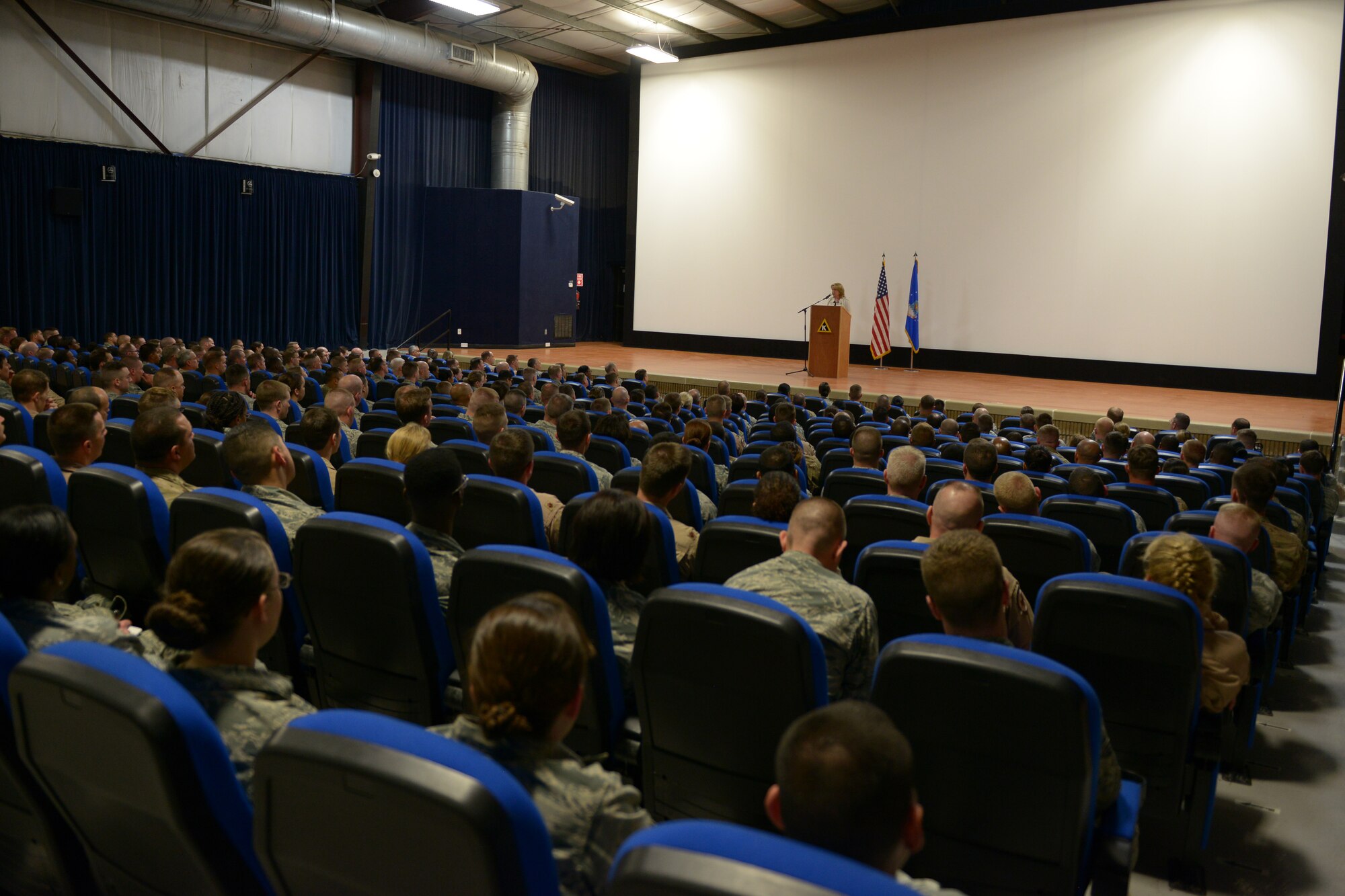 Secretary of the Air Force Deborah Lee James speaks with Airmen from the 379th Air Expeditionary Wing and the Combined Air Operations Center during an all call at Al Udeid Air Base, Qatar, Mar. 18, 2014.  During the call, James spoke about her three priorities for the Air Force; taking care of people, balancing readiness of today with readiness of tomorrow and making every dollar count.  She also highlighted the Air Force Core Values, praising  Airmen for living them personally but asking that they keep them a "team sport" as well.  (U.S. Air Force photo/Master Sgt. David Miller)
