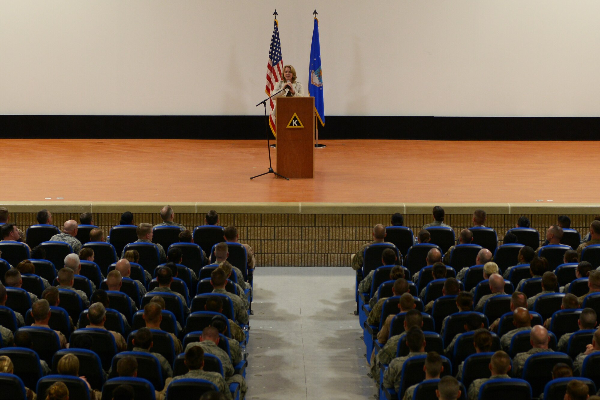 Secretary of the Air Force Deborah Lee James speaks with Airmen from the 379th Air Expeditionary Wing and the Combined Air Operations Center during an all call at Al Udeid Air Base, Qatar, Mar. 18, 2014.  During the call, James spoke about her three priorities for the Air Force; taking care of people, balancing readiness of today with readiness of tomorrow and making every dollar count.  She also highlighted the Air Force Core Values, praising Airmen for living them personally but asking that they keep them a "team sport" as well.  (U.S. Air Force photo/Master Sgt. David Miller)
