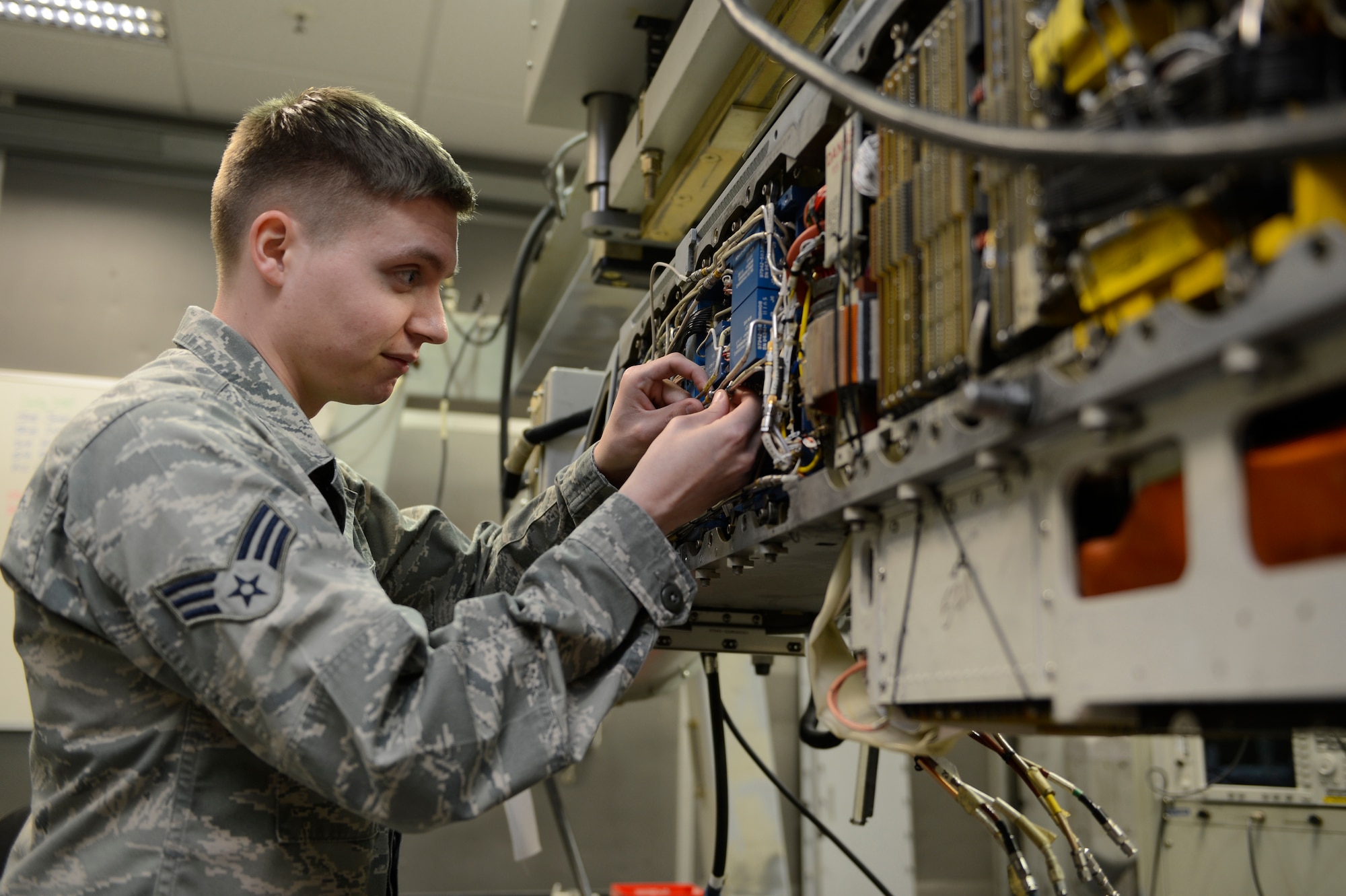 U.S. Air Force Senior Airman Christopher Peoples, 52nd Component Maintenance Squadron avionics sensors and electronic warfare systems technician from  Mount Pocono, Pa., performs maintenance on an AN/ALQ-131 electronic counter measure pod, March 12, 2014, at Spangdahlem Air Base, Germany. The ECM pod contains transmitters that allows a pilot to engage and disrupt the flight path of any incoming enemy missile. (U.S. Air Force photo by Staff Sgt. Christopher Ruano/Released)