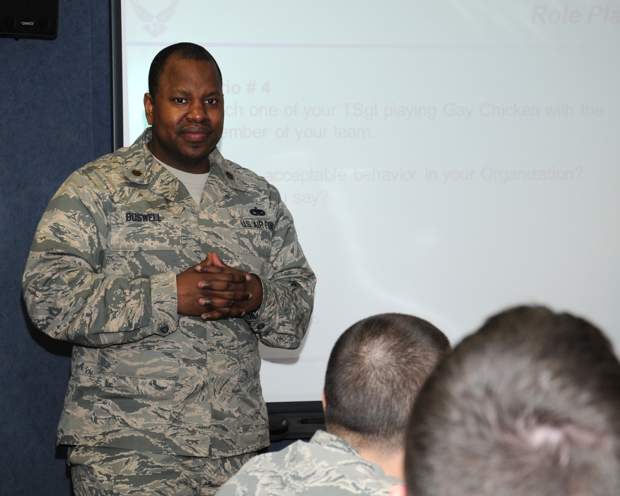 U.S. Air Force Maj. Michael Boswell, 100th Logistics Readiness Squadron commander, meets with Airmen from his squadron during a sexual assault prevention and response meeting March 14, 2014, on RAF Mildenhall, England. Boswell discussed his leadership views on assertive communication, and how he expects his supervisors to ensure they create a working environment where each person will feel comfortable at work. He also discussed methods the group uses each day to remain safe. (U.S. Air Force photo by Gina Randall/Released)