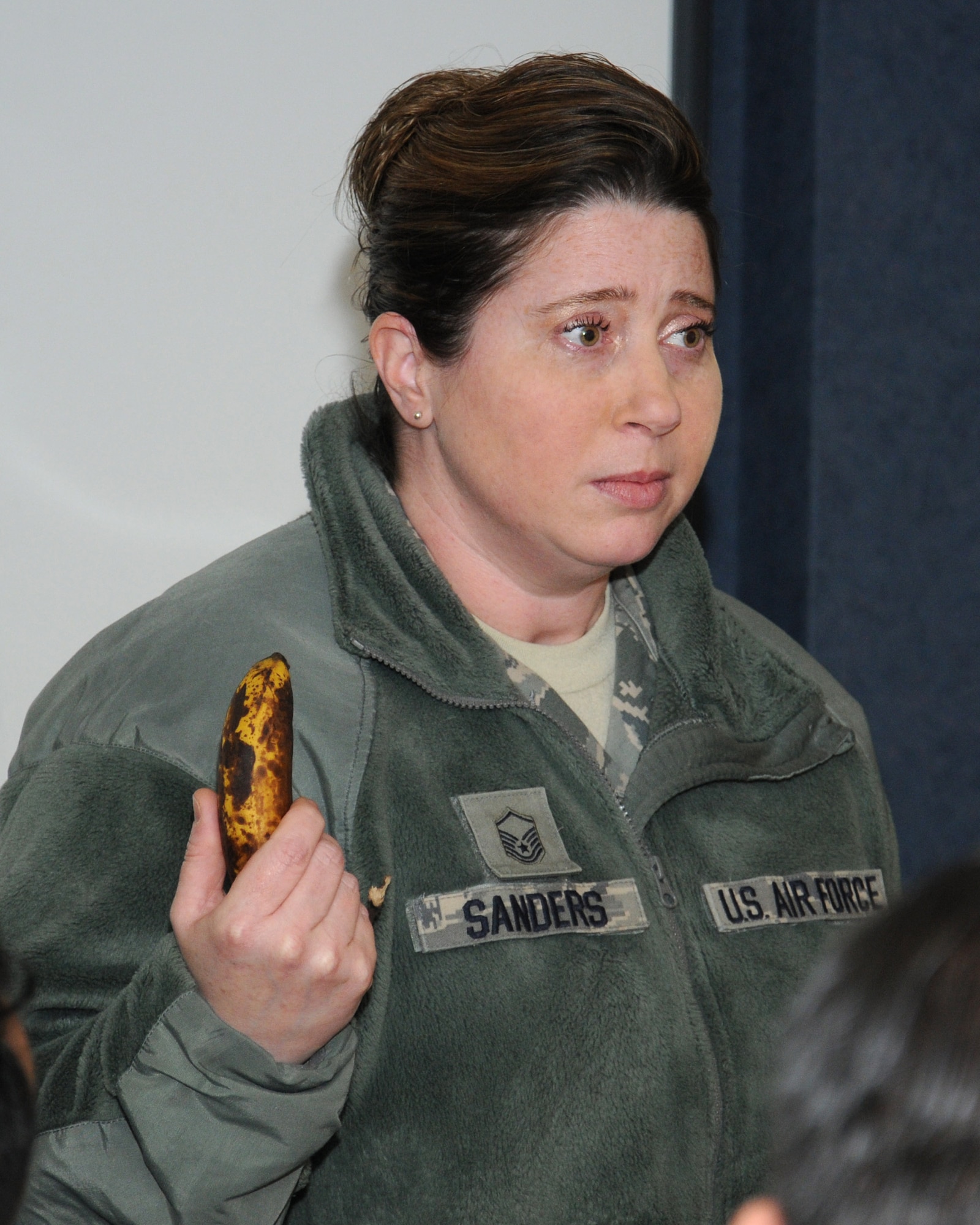 U.S. Air Force Master Sgt. Tamela Sanders, 352nd Special Operations Maintenance Squadron Maintenance Training Section superintendent and a victim advocate from Pensacola, Fla., uses a rotten banana during a demonstration in a sexual assault prevention and response training leadership course March 14, 2014, on RAF Mildenhall, England. The training was for supervisors from the 100th Logistics Readiness Squadron. The banana demonstrated how a sexual assault survivor may feel. These feelings included emotions ranging from betrayal, self blame and denial to guilt and shame. (U.S. Air Force photo by Gina Randall/Released)
