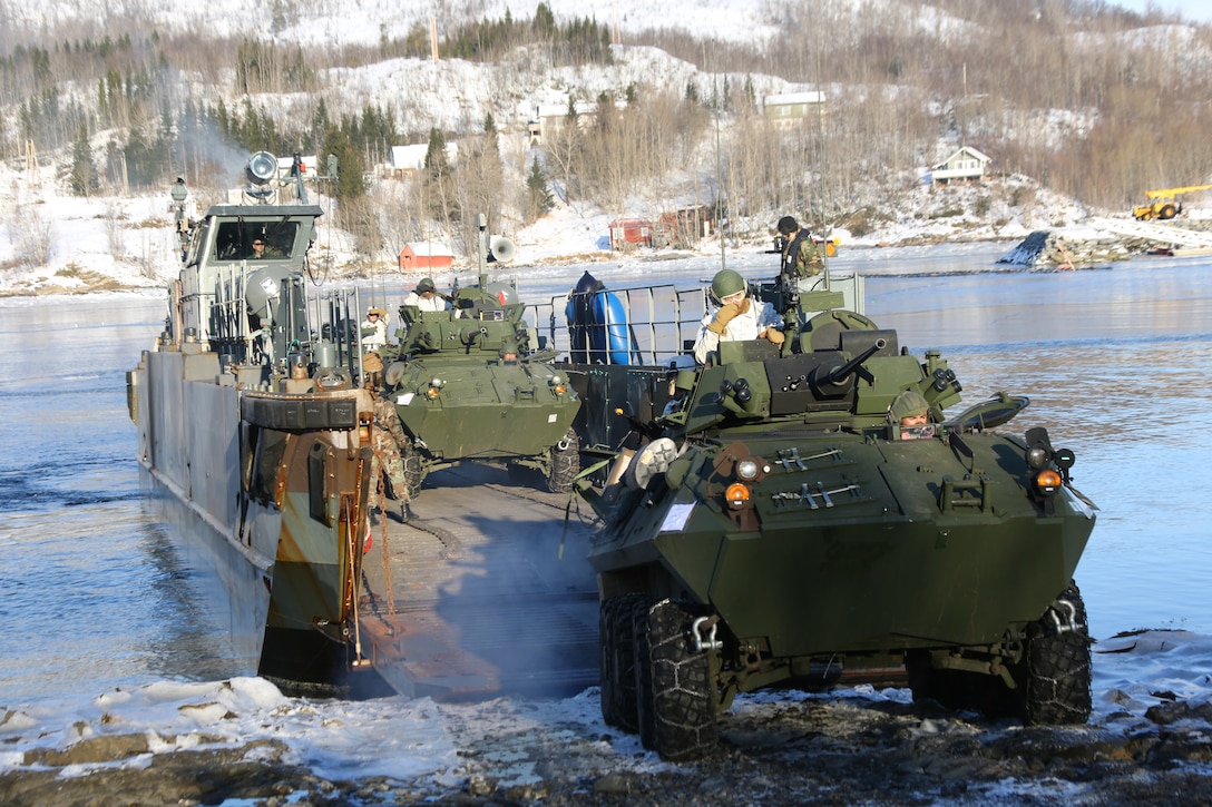 An LAV-25 secures the beachhead during an amphibious raid rehearsal, March 17, 2014. Marines from 2nd Battalion, 2nd Marine Regiment, 2nd Marine Division and Norwegian soldiers spent two days spent aboard the HNLS Rotterdam to train with Dutch sailors and marines for the amphibious raid during Cold Response 14, a multinational and multilateral training exercise featuring various types of military training including maritime, land and air operations. The location, above the Arctic Circle in northern Norway, provides a unique cold-weather environment for all forces involved to learn and develop procedures from an international contingent of allies. 