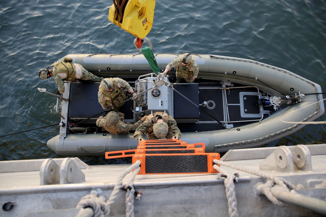 Marines from Marine Forces Europe and Africa board a rigid-hull inflatable boat from the joint high-speed vessel USNS Spearhead, March 5, 2014. The Marines practiced boarding the RHIB with their protective vests and Kevlar helmets before setting out for their actual exercise in order to gain a better understanding of how the RHIB operates. (Official Marine Corps Photo by Sgt. Ed Galo)