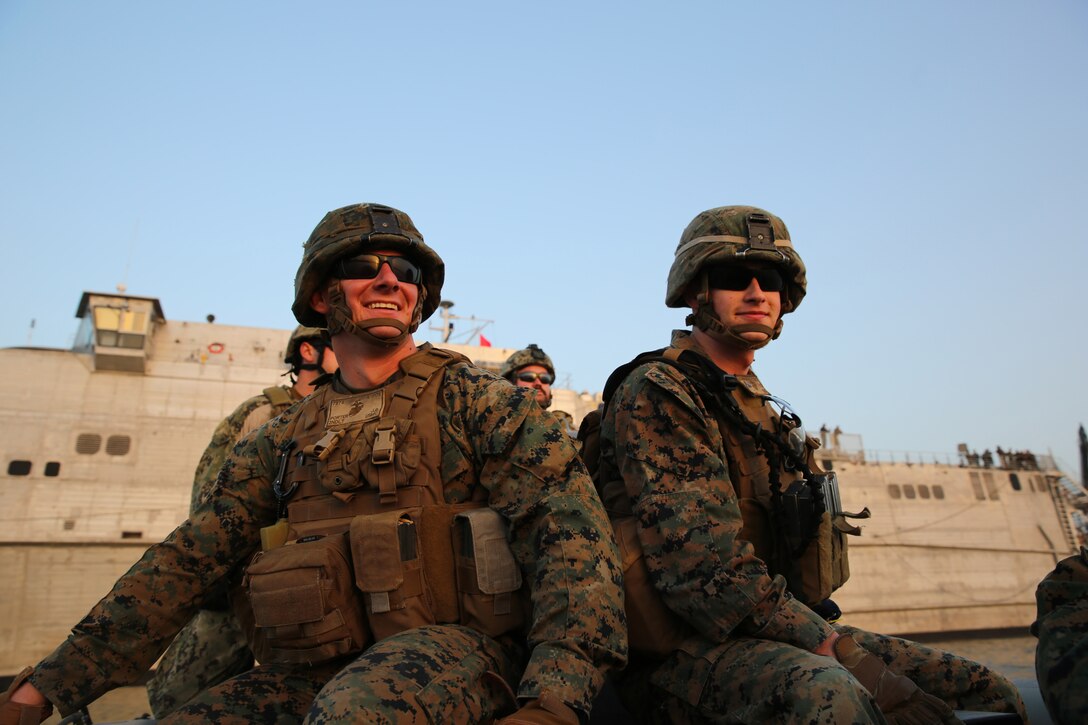 Second Lieutenant John Porter, team commander, and Lance Cpl. Jacob Haygood, infantryman, both Marines from Marine Forces Europe and Africa, ride a rigid-hull inflatable boat from the joint high-speed vessel USNS Spearhead, March 5, 2014. The Marines practiced boarding the RHIB with their protective vests and Kevlar helmets before setting out for their actual exercise in order to gain a better understanding of how the RHIB operates. (Official Marine Corps Photo by Sgt. Ed Galo)