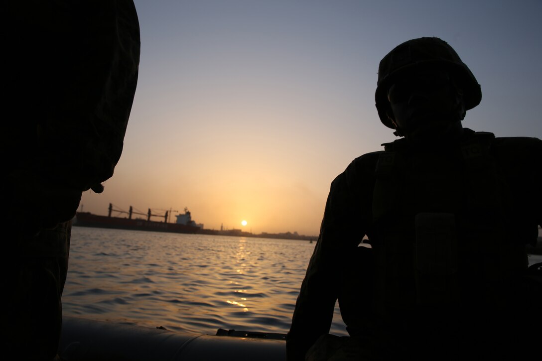 Petty Officer 2nd Class Trevor Williams, a corpsman from Marine Forces Europe and Africa, rides a rigid-hull inflatable boat from the joint high-speed vessel USNS Spearhead, March 5, 2014. The Marines practiced boarding the RHIB with their protective vests and Kevlar helmets before setting out for their actual exercise in order to gain a better understanding of how the RHIB operates. (Official Marine Corps Photo by Sgt. Ed Galo)