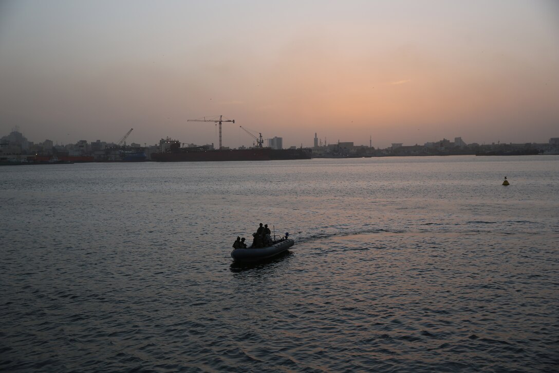 Marines from Marine Forces Europe and Africa ride a rigid-hull inflatable boat from the joint high-speed vessel USNS Spearhead, March 5, 2014. The Marines practiced boarding the RHIB with their protective vests and Kevlar helmets before setting out for their actual exercise in order to gain a better understanding of how the RHIB operates. (Official Marine Corps Photo by Sgt. Ed Galo)