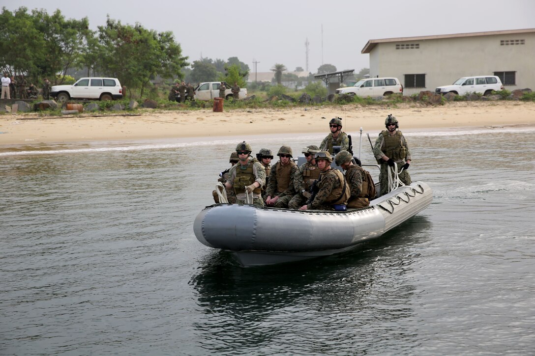 Marines from Marine Forces Europe and Africa ride a rigid-hull inflatable boat from the joint high-speed vessel USNS Spearhead onto a dock in Monrovia, Liberia, during a training exercise March 7, 2014. The Marines conducted the training in order to test the capabilities of the Spearhead and to prepare response forces for potential situations of regional instability and strengthen interagency coordination between the U.S. and the Liberian government and military. (Official Marine Corps Photo by Sgt. Ed Galo)