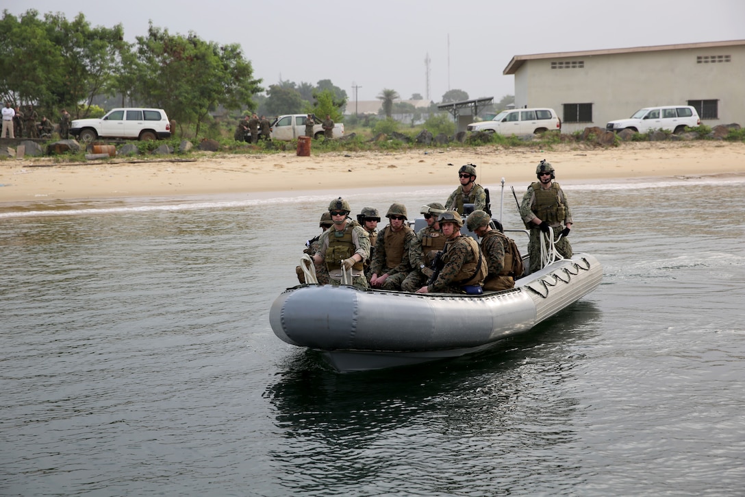 Marines from Marine Forces Europe and Africa ride a rigid-hull inflatable boat from the joint high-speed vessel USNS Spearhead onto a dock in Monrovia, Liberia, during a training exercise March 7, 2014. The Marines conducted the training in order to test the capabilities of the Spearhead and to prepare response forces for potential situations of regional instability and strengthen interagency coordination between the U.S. and the Liberian government and military. (Official Marine Corps Photo by Sgt. Ed Galo)