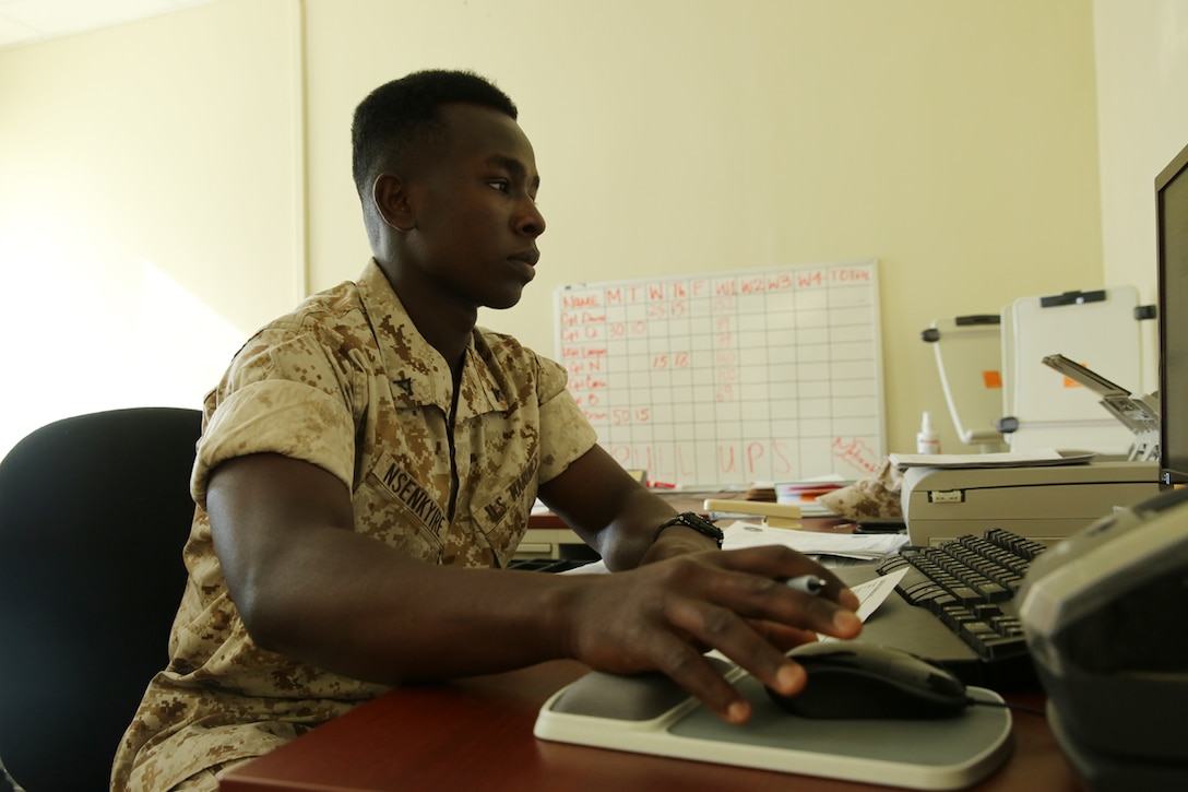 Lance Cpl. Andrews K. Nsenkyire provides assistance for Marines as an administrative specialist at Marine Corps Air Station Cherry Point's Installation Personnel Administration Center. Nsenkyire recently earned the title of station Marine of the Quarter and will soon compete for Marine Corps Installations East Marine of the Quarter. Nsenkyire is a native of Ghana who enlisted in the Marine Corps after winning a national immigration visa lottery in his home country before emigrating to the U.S. in May 2012. 