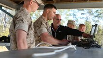 Marines with 2nd Combat Engineer Battalion, 2nd Marine Division, learn to operate an R2C robot during a training exercise aboard Marine Corps Base Camp Lejeune, N.C., March 11. R2C robots can scout for roadside bombs, search buildings and vehicles and are capable of going up to 800 meters away from the control point. 