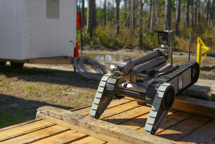 An R2C robot, operated by a Marine with 2nd Combat Engineer Battalion, 2nd Marine Division, maneuvers over an obstacle during a training exercise aboard Marine Corps Base Camp Lejeune, N.C., March 11. The robot is controlled through a computer and handheld controller, and is used to go places too dangerous for Marines. The robot can climb stairs and maneuver any terrain. 