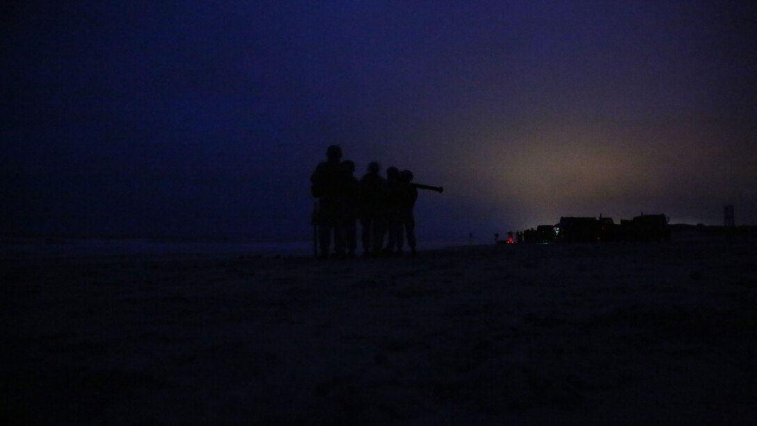 Marines with 2nd Low Altitude Air Defense Battalion work together to visually locate an unmanned aerial vehicle target during PL-87 Stinger Missile live fire training at Onslow Beach, Marine Corps Base Camp Lejeune, N.C. March 18, 2014.