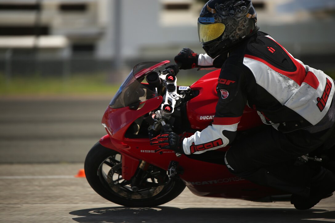 A student maneuvers around a turn during the Marine Corps Base Hawaii Total Control Track Clinic at the P-3 Ramp, March 14. The Base Safety Directorate teamed up with Lee Parks' Total Control Advanced Clinic to teach the course.(U.S. Marine Corps photo by Cpl. Sarah Dietz)
