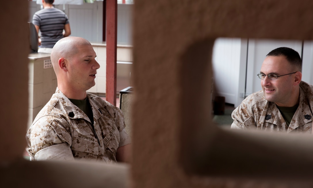 Gunnery Sgt. Derek Lisowski, left, platoon sergeant with Bravo Battery, 3rd Low Altitude Air Defense Battalion, speaks with Gunnery Sgt. Jason Daniel, right, ordnance production control chief with Marine Aviation Logistics Squadron 13, during a break out discussion session at the Master Sergeant – Gunnery Sergeant Committed and Engaged Leadership Symposium aboard Marine Corps Air Station Miramar, Calif., March 19 – 21. 