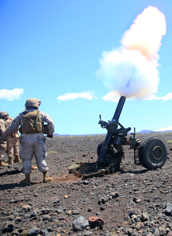 A field artilleryman with Bravo Battery, 1st Battalion, 12th Marine Regiment, pulls the lanyard on a M327 120 mm mortar system during Operation Spartan Fury 14.2 at Pohakuloa Training Area, Hawaii, March 11, 2014.(U.S. Marine Corps photo by Cpl. Nathan Knapke) 