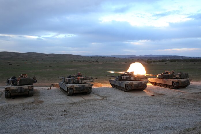 Marines with the tank platoon, Battalion Landing Team 2nd Battalion, 1st Marines (BLT 2/1), part of the 11th Marine Expeditionary Unit, fire the 120mm smoothbore cannon of four M1A1 Abrams tanks during a live-fire training exercise at Fort Hunter Liggett, Calif., March 20. Realistic Urban Training Marine Expeditionary Unit Exercise (RUTMEUEX) 14-1 allows the Marines and sailors of the 11th MEU the opportunity to employ techniques and tactics applicable to their future deployment. RUTMEUEX incorporates the majority of the ground combat element, aviation combat element, logistics combat element and command element of the MEU for the first time in the predeployment cycle. 
