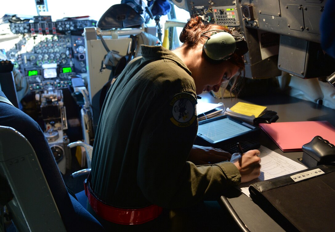 Airman 1st Class Rebekah McCormack, 96th Air Refueling Squadron in-flight refueling specialist, takes care of pre-flight safety items before her mission aboard a KC-135 Stratotanker at Joint Base Pearl Harbor-Hickam, Hawaii, March 20, 2014. During the mission McCormack trained on refueling procedures for a C-17 Globemaster III. (U.S. Air Force photo/Staff Sgt. Alexander Martinez)