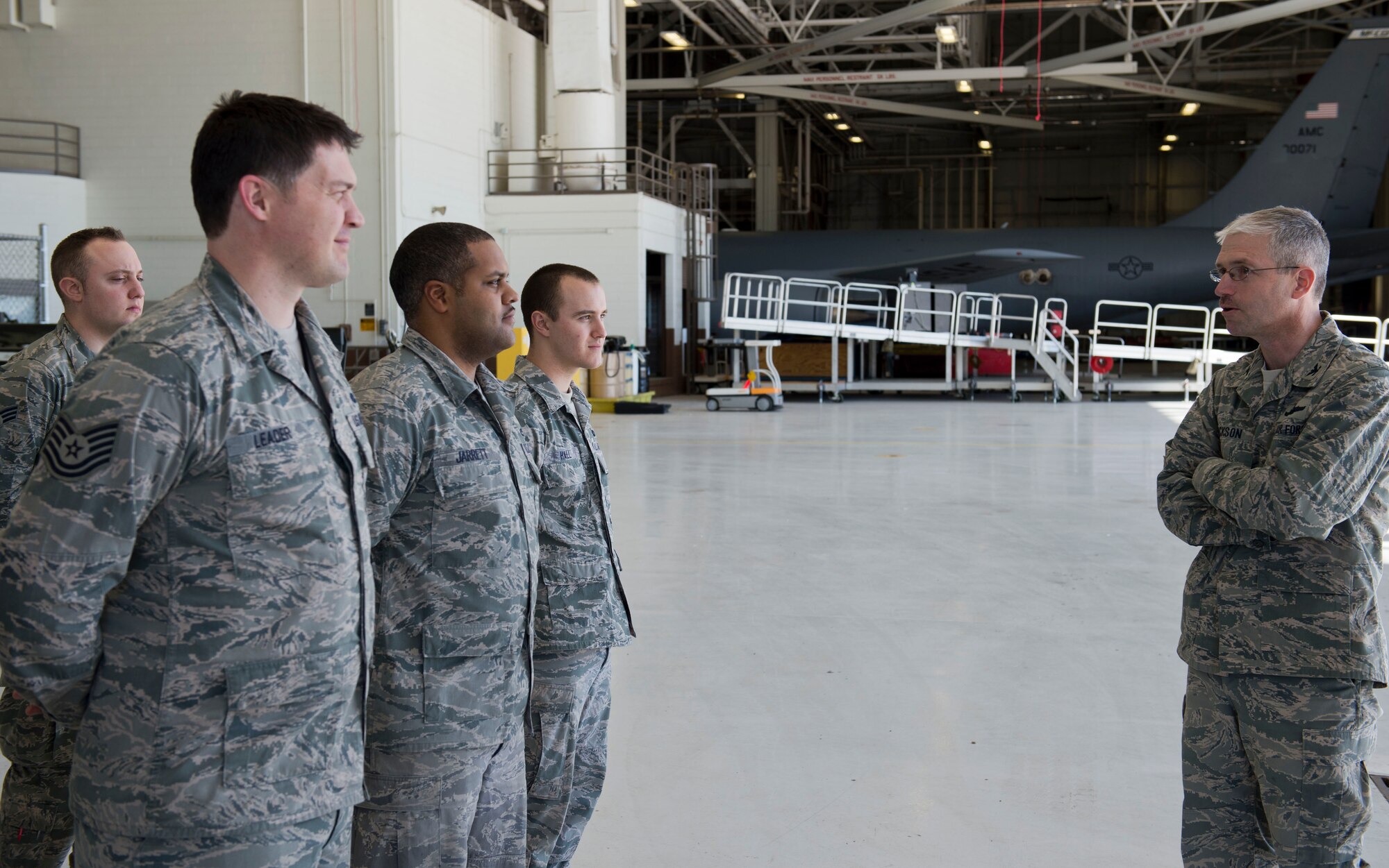Col. Joel Jackson, 22nd Air Refueling Wing commander, talks to members of the 22nd Maintenance Squadron electrical and environmental systems flight, March 13, 2014, at McConnell Air Force Base, Kan. He visited the flight to recognize Airmen for their outstanding supervisory skills (U.S. Air Force photo/Airman 1st Class Colby L. Hardin)