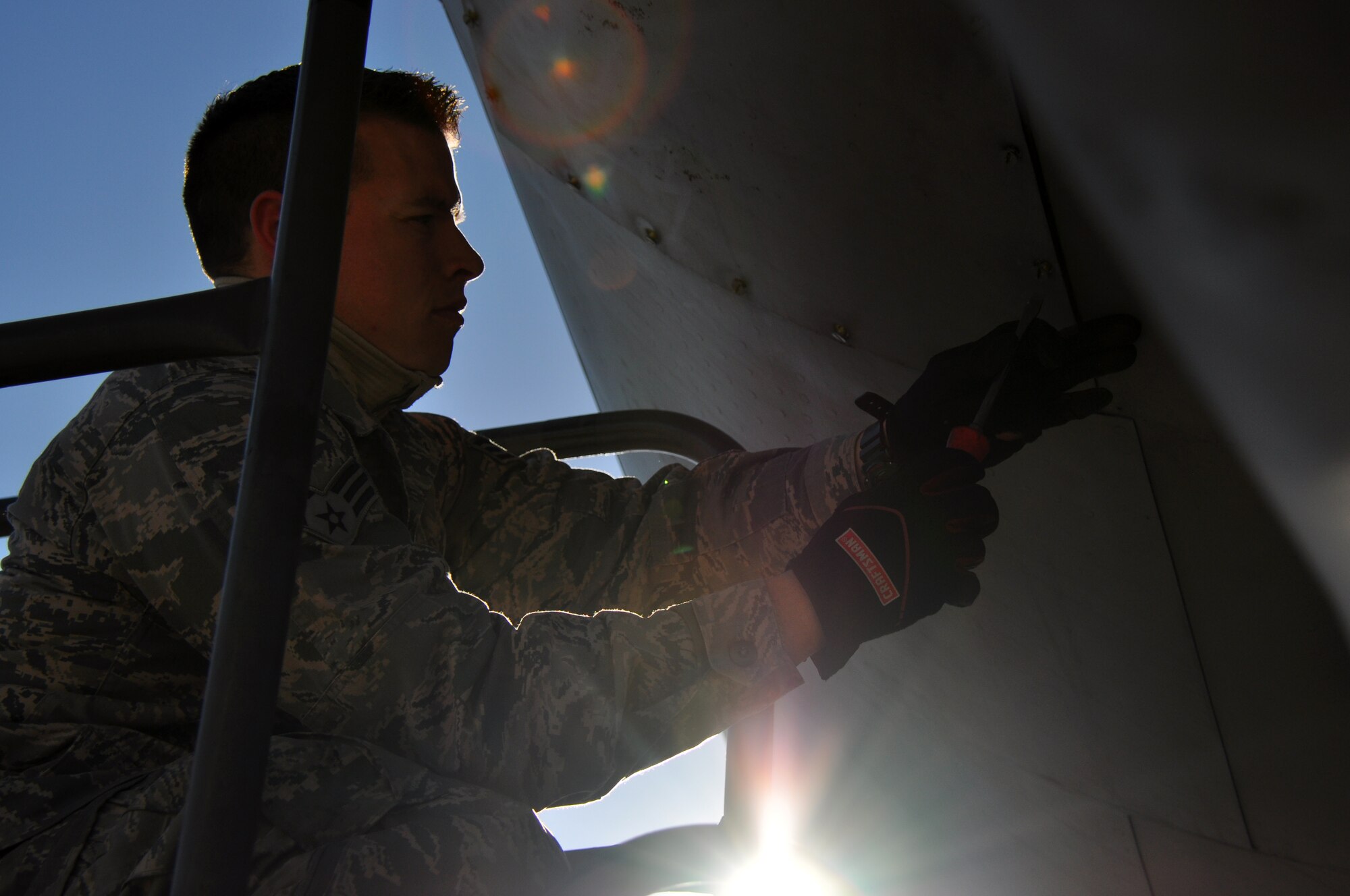 Senior Airman Michael Hall II, 137th Oklahoma Air National Guard Air Refueling Wing Maintenance Squadron, seals a panel during an Hourly Post Flight inspection Monday March 17.  The inspection performed on one of the 507th Air Refueling Wing’s KC-135R Stratotankers is accomplished every 60 days.  It involves servicing components on the aircraft that are not looked at during a normal preflight or thru flight inspection.  (U.S. Air Force photo/Senior Airman Mark Hybers)