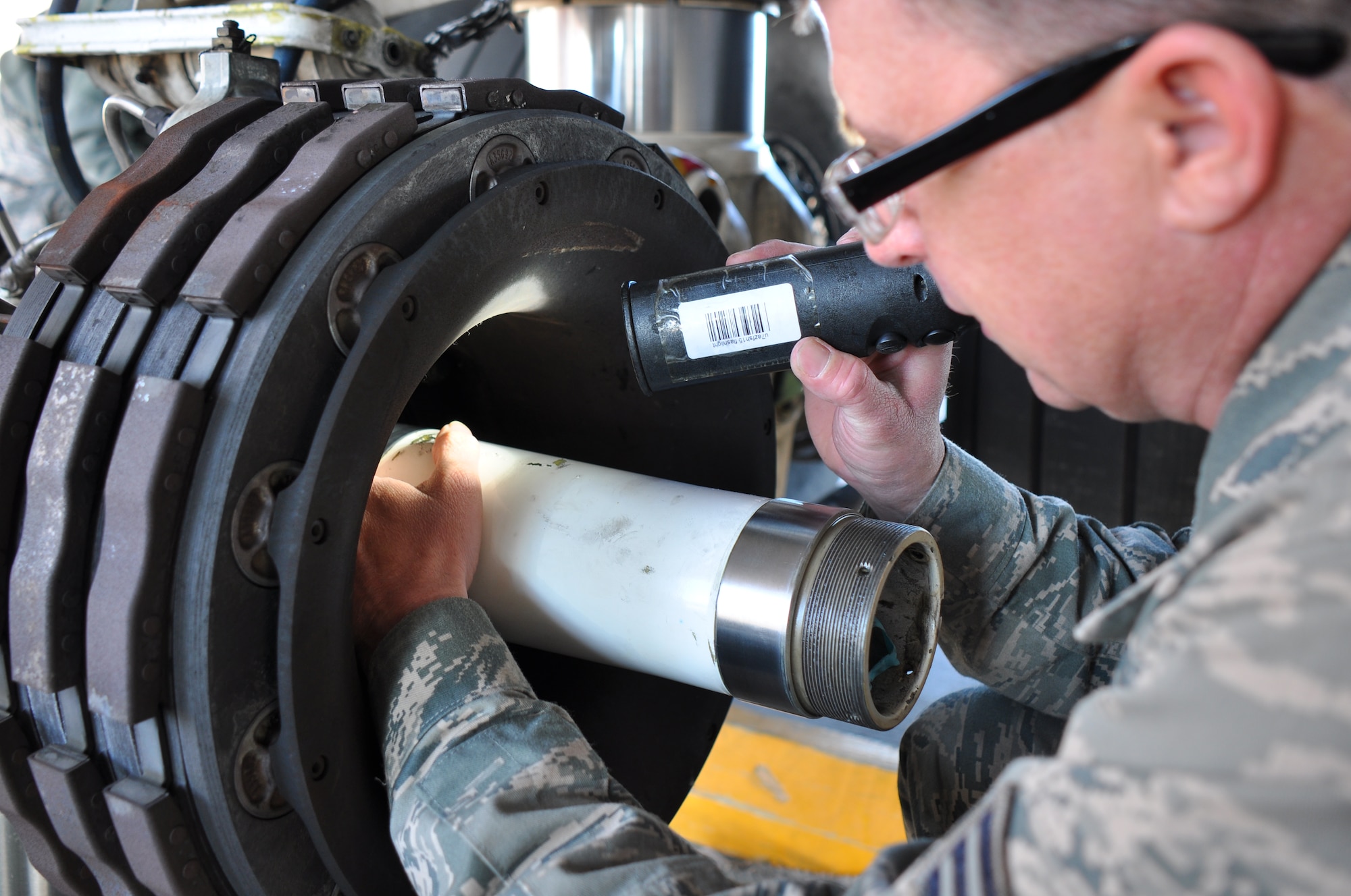 Senior Airman Bradley Hawkins, 137th Oklahoma Air National Guard Air Refueling Wing Maintenance Squadron removes the interior wheels and inspects the axel for any damages during an Hourly Post Flight inspection Monday March 17.  The inspection performed on one of the 507th Air Refueling Wing’s KC-135R Stratotankers is accomplished every 60 days.  It involves servicing components on the aircraft that are not looked at during a normal preflight or thru flight inspection.  (U.S. Air Force photo/Senior Airman Mark Hybers)