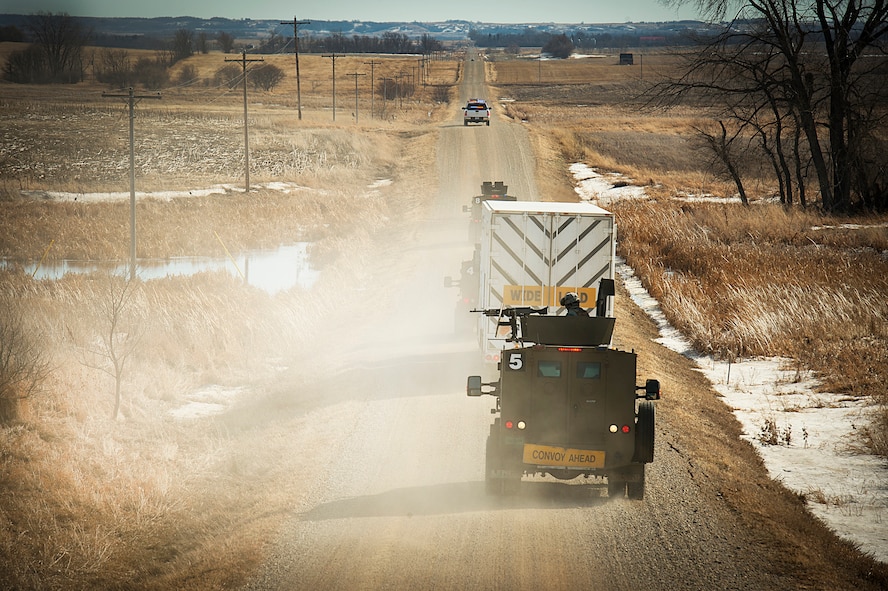 Members of the 91st Missile Security Force Squadron convoy response force conduct operations during a mission in the 91st Missile Wing missile complex, March 12, 2014. The missile field complex is split between north and south for security flights consisting of 15 different missile alert facilities and 150 different launch facilities covering more than 8,500 square miles. (U.S. Air Force photo/Tech. Sgt. Aaron Allmon)
