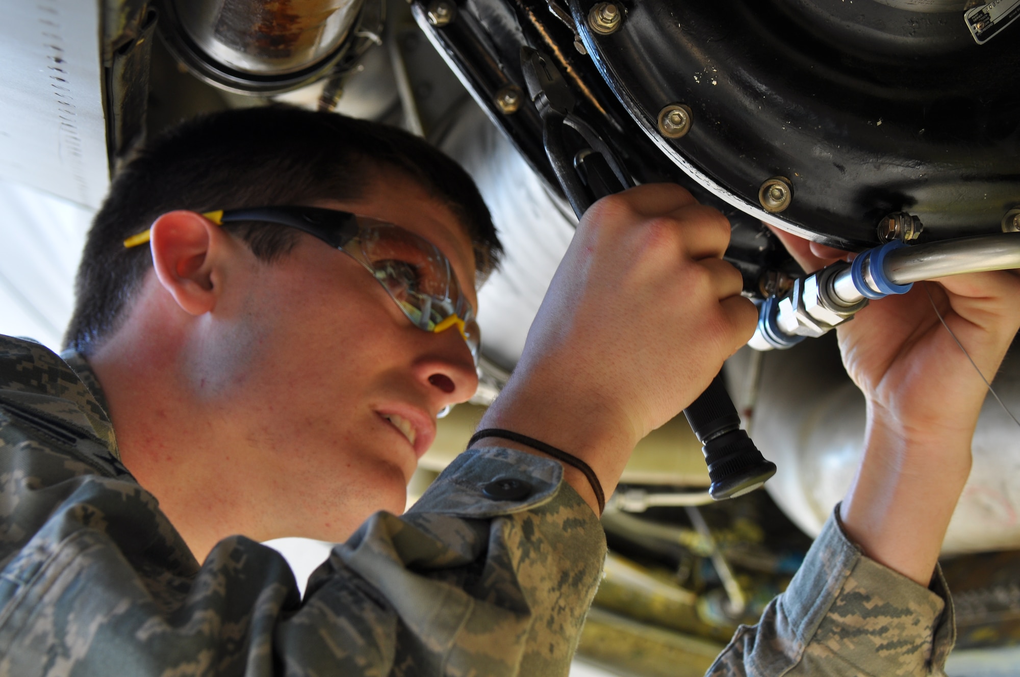 Senior Airman Jaron Dowell, 507th MXS, Maintenance Flight applies safety wiring to a drain plug on the Air Cycle Machine during an hourly post flight inspection Monday March 17.  The inspection performed on one of the 507th Air Refueling Wing’s KC-135R Stratotankers is accomplished every 60 days.  It involves servicing components on the aircraft that are not looked at during a normal preflight or thru flight inspection.  (U.S. Air Force photo/Senior Airman Mark Hybers)