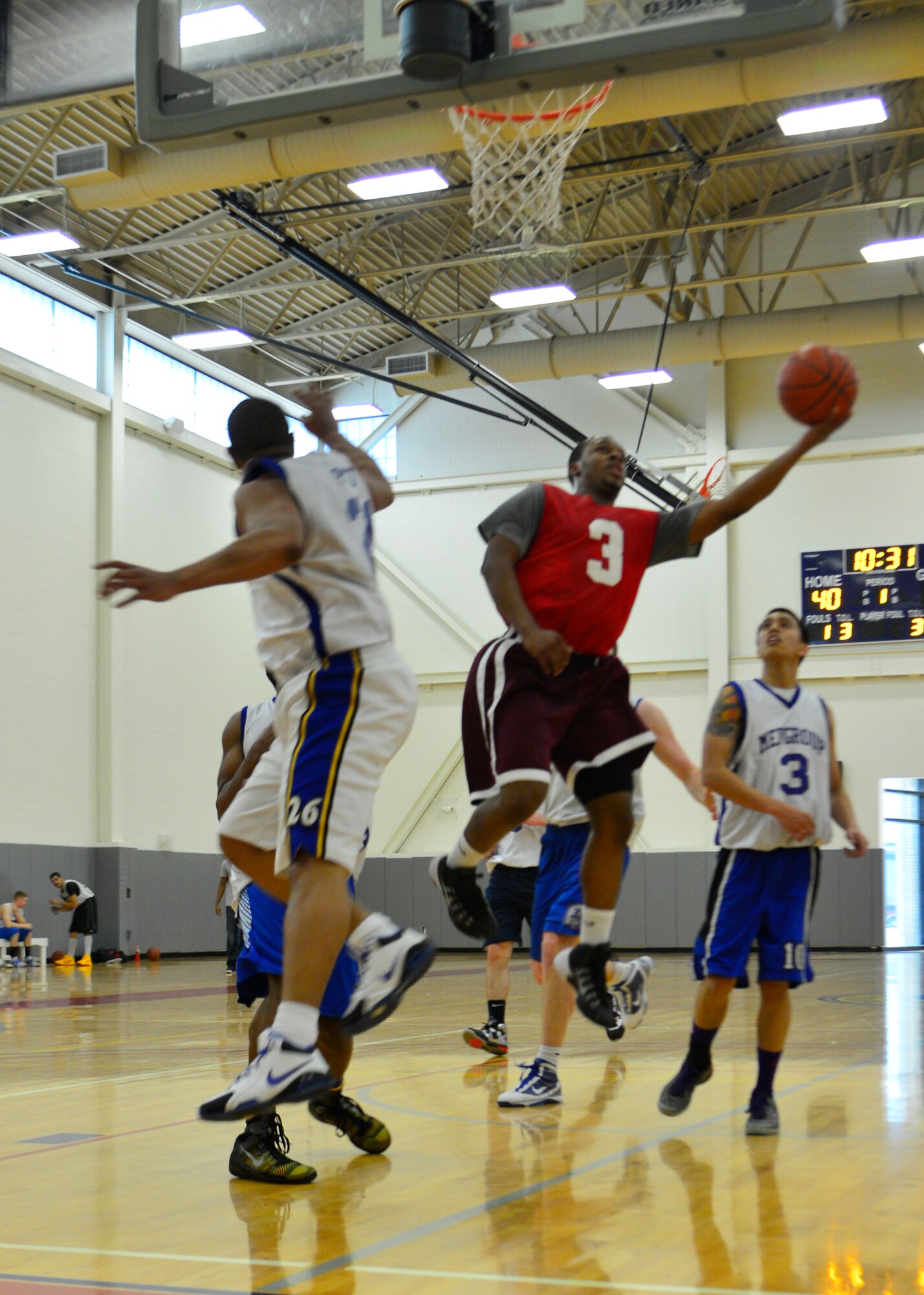 Kenny Roberts, 436th Aerial Port Squadron point guard, drives for a lay-up in the intramural basketball championship game March 18, 2014, at the fitness center on Dover Air Force Base, Del. Roberts scored 12 points  but the 436th APS fell to the 436th Medical Group 54-27. (U.S. Air Force photo/Airman 1st Class William Johnson)