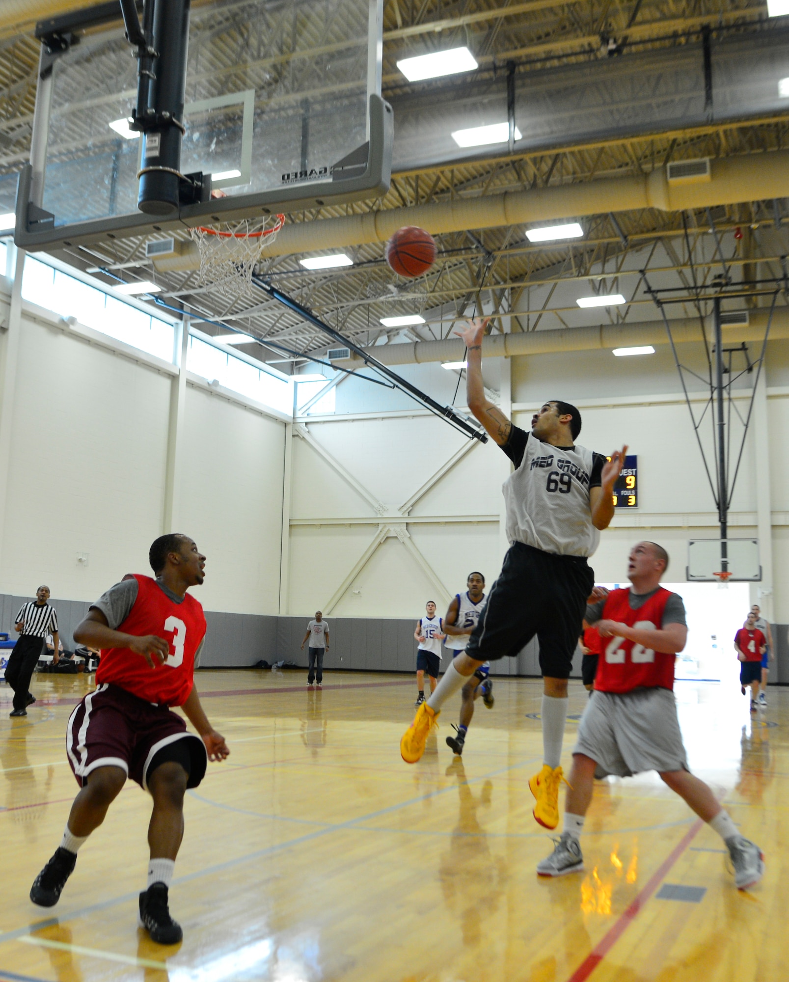 Terrance McCormack, 436th Medical Group forward, goes up for a layup during the intramural basketball championship game March 18, 2014, at the fitness center on Dover Air Force Base, Del. The 436th MDG defeated the 436th APS in a 54-27 to win the base championship. (U.S. Air Force photo/Airman 1st Class William Johnson)