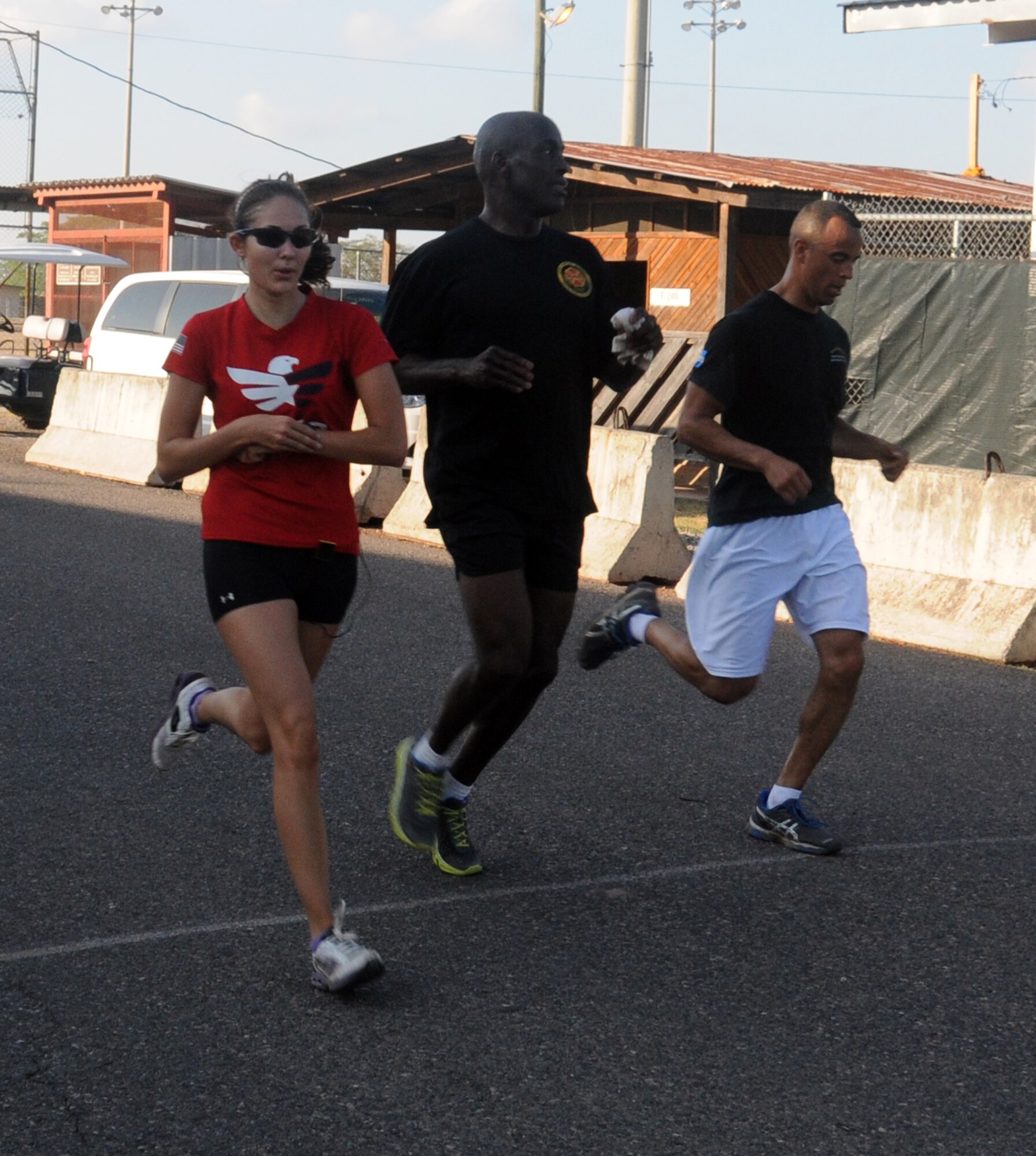 Joint Task Force-Bravo members finish the grueling 6.6 mile perimeter fun run/walk at Soto Cano Air Base, Honduras, March 21, 2014.  The race was organized by the Army Support Activity's (ASA) Department of Family Morale, Welfare and Recreation.  (Photo by U. S. Air National Guard Capt. Steven Stubbs)