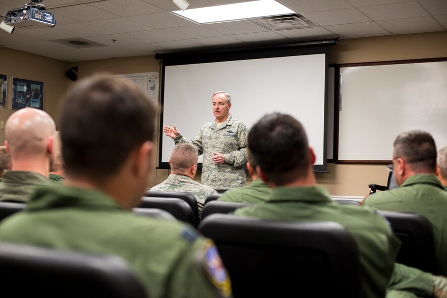 Air Force Chief of Staff Gen. Mark A. Welsh III addresses an audience of 23d Fighter Group A-10C Thunderbolt II pilots at Moody Air Force Base, Ga., March 21, 2014. Welsh provided insight on the reasoning behind the recent budget proposal to phase out the airframe and the way ahead for affected pilots. (U.S. Air Force photo by Airman 1st Class Ryan Callaghan/Released)