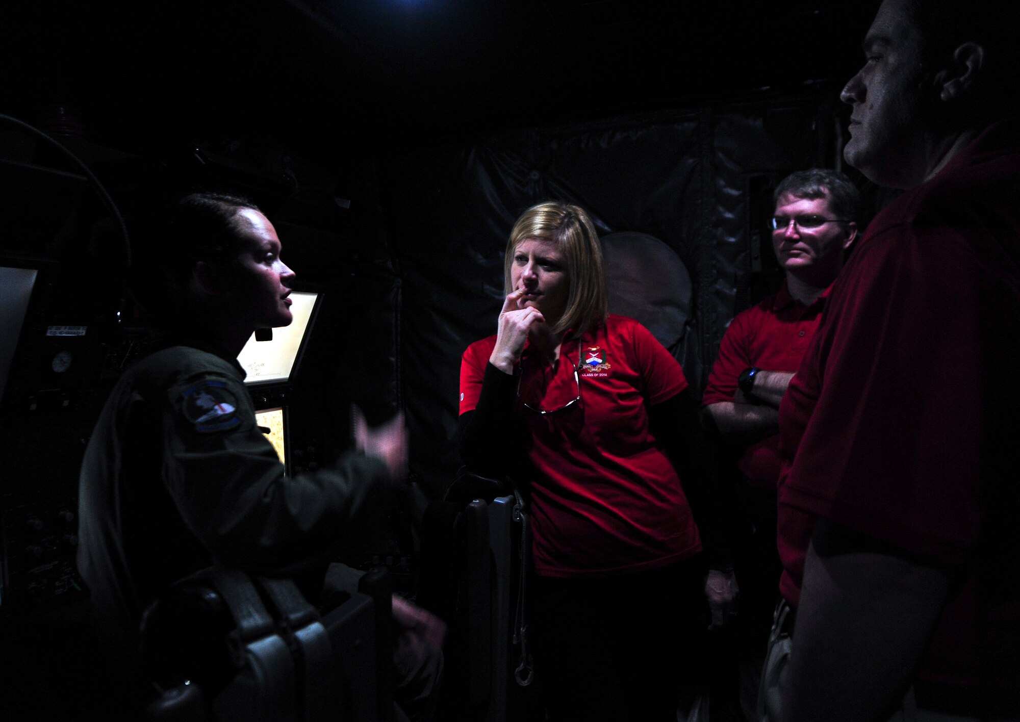 An AC-130 gunship crewmember explains the aircraft’s operations during a tour for National War College students on the flightline at Hurlburt Field, Fla., March 21, 2014.  The students, including service members from all military branches and civilians from various federal departments, visited different military installations as part of their curriculum. (U.S. Air Force photo/Senior Airman Michelle Patten)