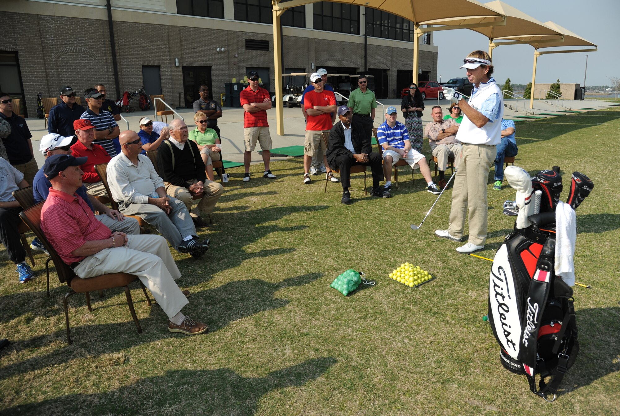 Professional Golfers’ Association champion player, Brad Faxon, provides personal golfing tips to base personnel during a free clinic March 20, 2014, at the Bay Breeze Golf Course, Keesler Air Force Base, Miss. Faxon is an eight-time PGA Tour Champion.  (U.S. Air Force photo by Kemberly Groue)