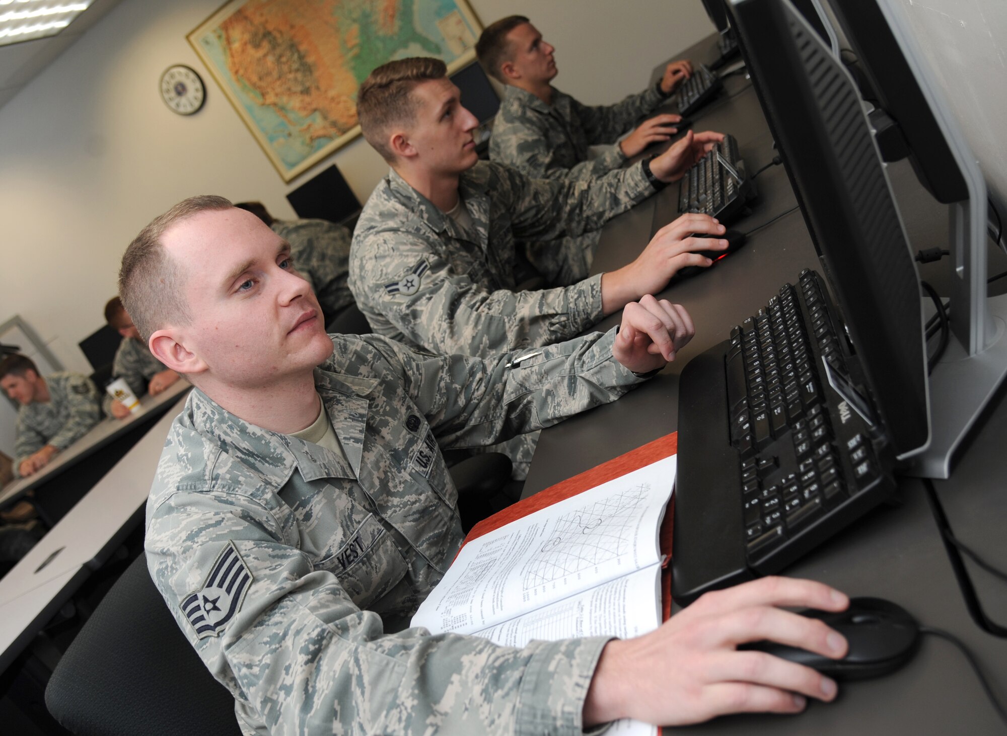 Staff Sgt. Jered Vest, 335th Training Squadron, reviews notes in the initial weather training course March 21, 2014, at the Weather Training Facility, Keesler Air Force Base, Miss.  Vest, from Iowa City, Iowa, graduated with perfect scores and will head to the 25th Operational Weather Squadron, Davis-Monthan Air Force Base, Ariz.  (U.S. Air Force photo by Kemberly Groue)