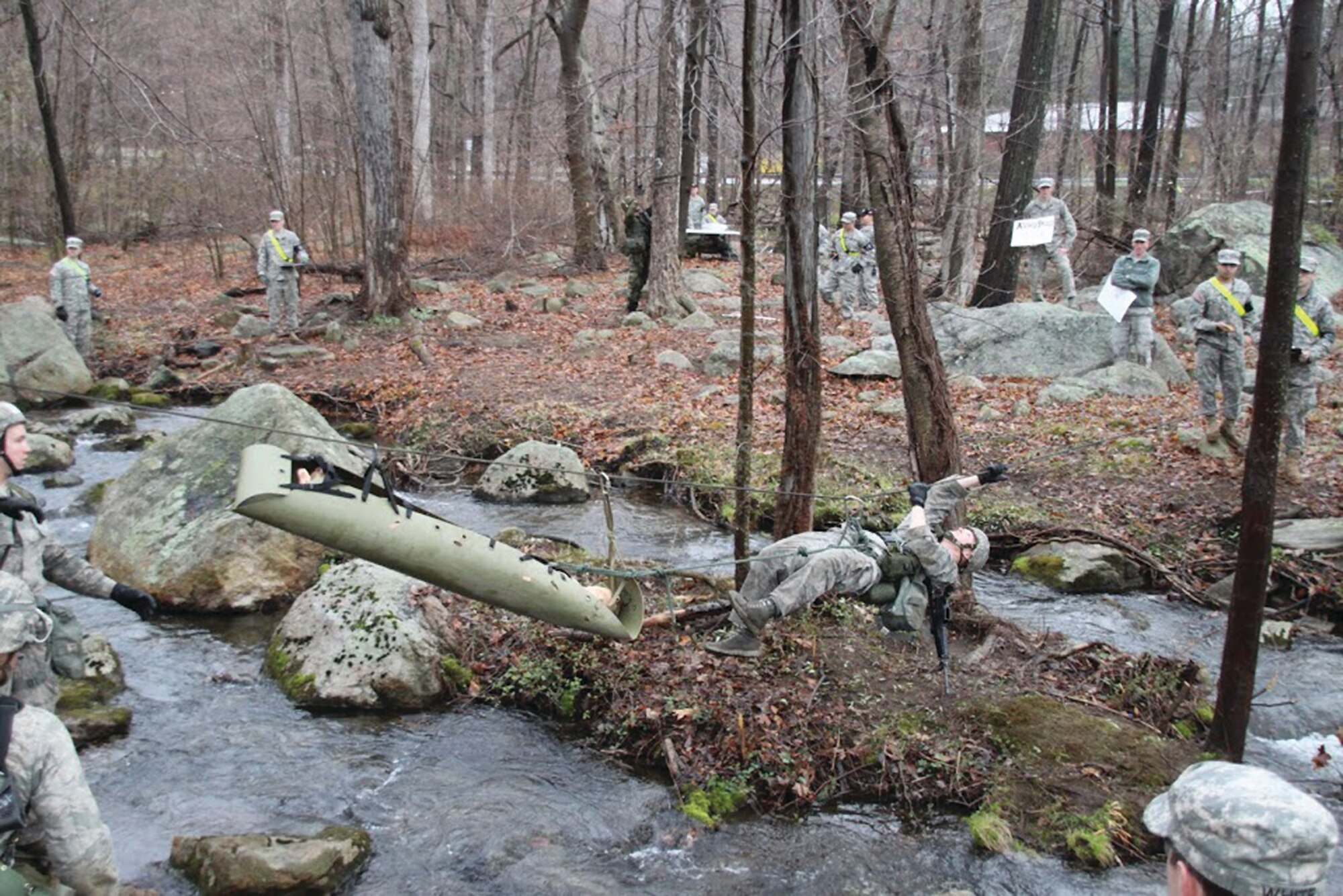 An Academy cadet uses a rope bridge to pull herself and a simulated combat casualty across a stream during last year's Sandhurst competition at the U.S. Military Academy. (Air Force photo/Tech. Sgt. Jon Hyder)