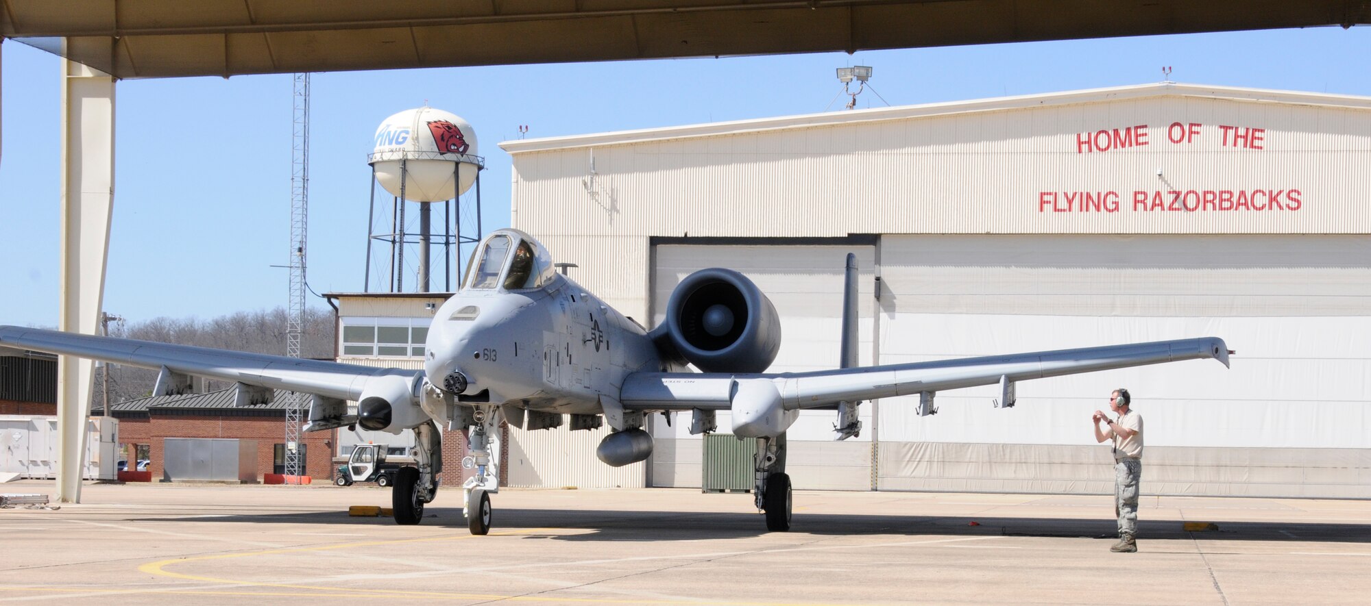 Master Sgt. Steve Bunting, a crew chief with the 188th Aircraft Maintenance Squadron, marshals a 188th A-10C Thunderbolt II "Warthog" (Tail No. 613) at Ebbing Air National Guard Base, Fort Smith, Ark. The A-10 was delivered from Ebbing ANG Base to Moody Air Force Base, Ga., March 11, 2014, as part of the 188th's mission conversion from the A-10 to a remotely piloted aircraft, intelligence and targeting mission. The 188th has five remaining A-10s on station. The next A-10 is slated to depart in April. The final two aircraft are scheduled to leave the 188th June 7, 2014. (U.S. Air National Guard photo by Tech Sgt. Josh Lewis/Released)