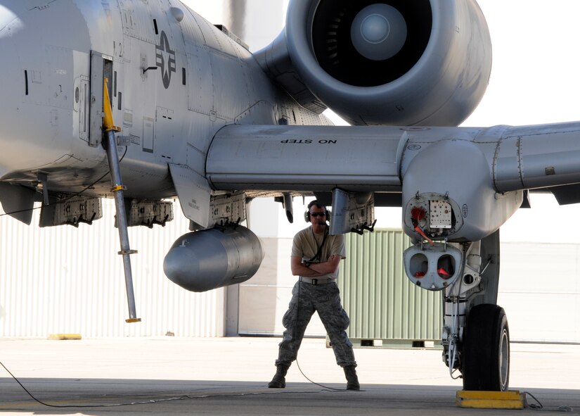 Master Sgt. Steve Bunting, a crew chief with the 188th Aircraft Maintenance Squadron, communicates with a pilot with the 23rd Wing prior to taxiing at Ebbing Air National Guard Base, Fort Smith, Ark. The 188th A-10C Thunderbolt II "Warthog" (Tail No. 613) was delivered from Ebbing ANG Base to Moody Air Force Base, Ga., March 11, 2014, as part of the 188th's mission conversion from the A-10 to a remotely piloted aircraft, intelligence and targeting mission. The 188th has five remaining A-10s on station. The next A-10 is slated to depart in April. The final two aircraft are scheduled to leave the 188th June 7, 2014. (U.S. Air National Guard photo by Tech Sgt. Josh Lewis/Released)