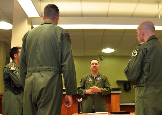 Tech. Sgt. Joshua Bates, a 13th Reconnaissance Squadron RQ-4 sensor operator, discusses Reserve career opportunities with three active-duty MC-12 pilots during an Air Force Reserve Career Fair in the Base Community Activity Center, March 19, at Beale Air Force Base, Calif. Reserve recruiters organized the event on the heels of the Air Force's Fiscal Year 15 Force Structure Plan released earlier this month calling for a rebalance of personnel and force structure into the Reserve Component. (U.S. Air Force photo/Tech. Sgt. Heather Skinkle)