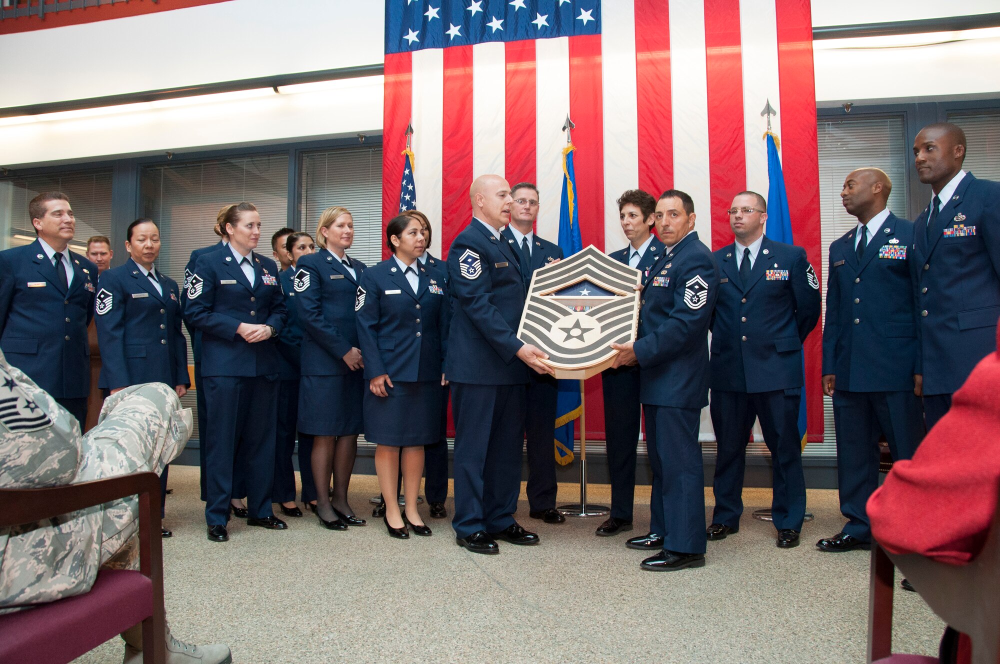 TRAVIS AIR FORCE BASE, Calif. -- Chief Master Sgt. Sandra "Sunny" Santos, 349th Air Mobility Wing, retired after nearly 33 years of service at a ceremony March 9, at Travis Air Force Base, Calif. (U.S. Air Force photos / Master Sgt. Rachel Martinez)

