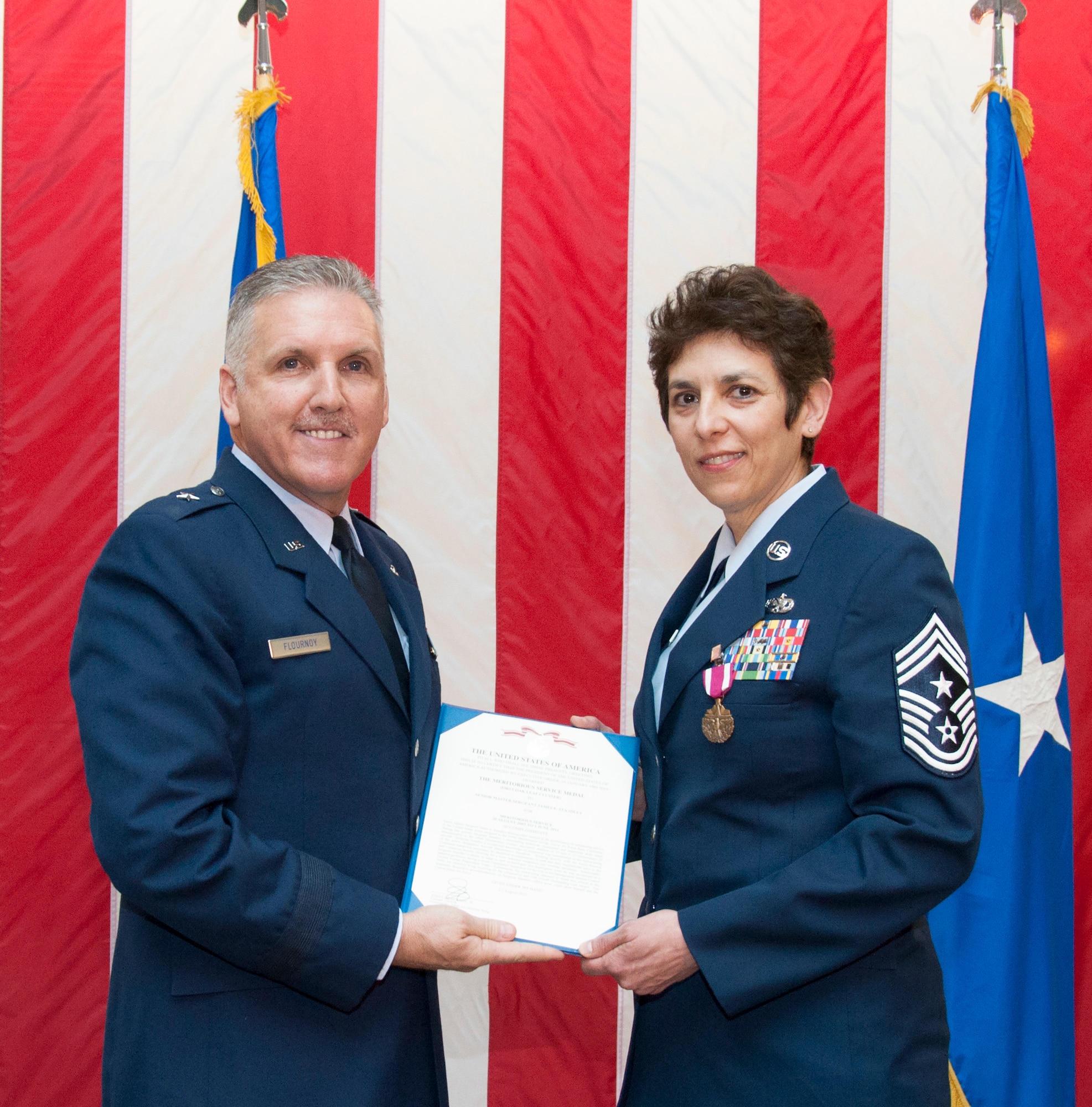 TRAVIS AIR FORCE BASE, Calif. -- Chief Master Sgt. Sandra "Sunny" Santos, 349th Air Mobility Wing, retired after nearly 33 years of service at a ceremony March 9, at Travis Air Force Base, Calif. (U.S. Air Force photos / Master Sgt. Rachel Martinez)

