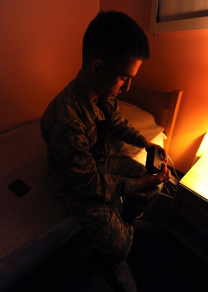 Airman 1st Class Brian Roupp, 341st Force Support Squadron missile chef, sets his alarm for 5:15 a.m. at a missile alert facility. Missile chefs assigned to Malmstrom Air Force Base will have two-year tours as missile chefs before transferring into a different functional area – lodging, fitness or readiness. (U.S. Air Force photo/Senior Airman Katrina Heikkinen) 