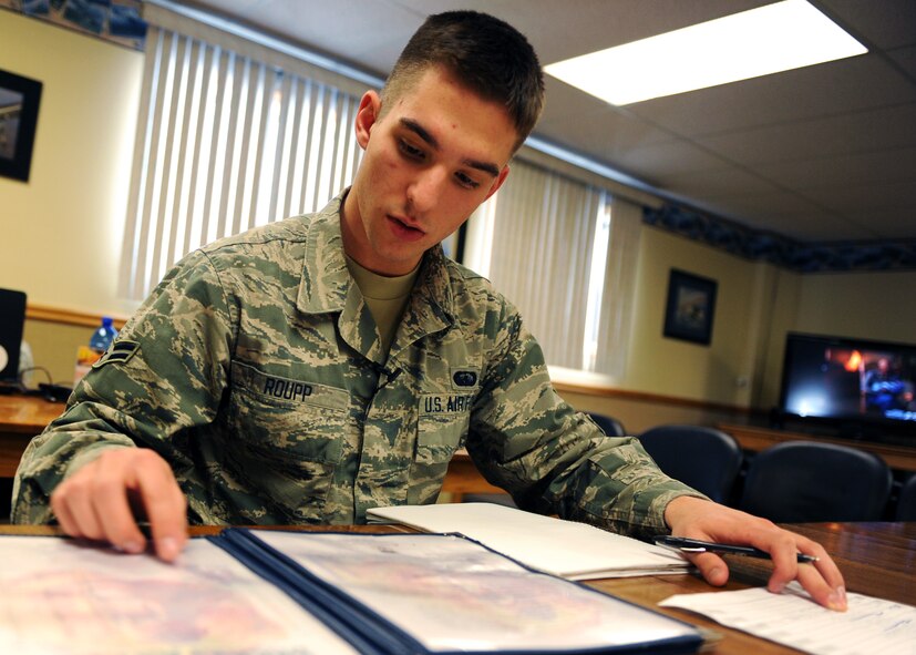 Airman 1st Class Brian Roupp, 341st Force Support Squadron missile chef, compiles a list of lunch orders and prices at a missile alert facility at the start of his three-day tour. A native of Williamsport, Penn., Roupp has been in the Air Force for nearly nine months. (U.S. Air Force photo/Senior Airman Katrina Heikkinen)