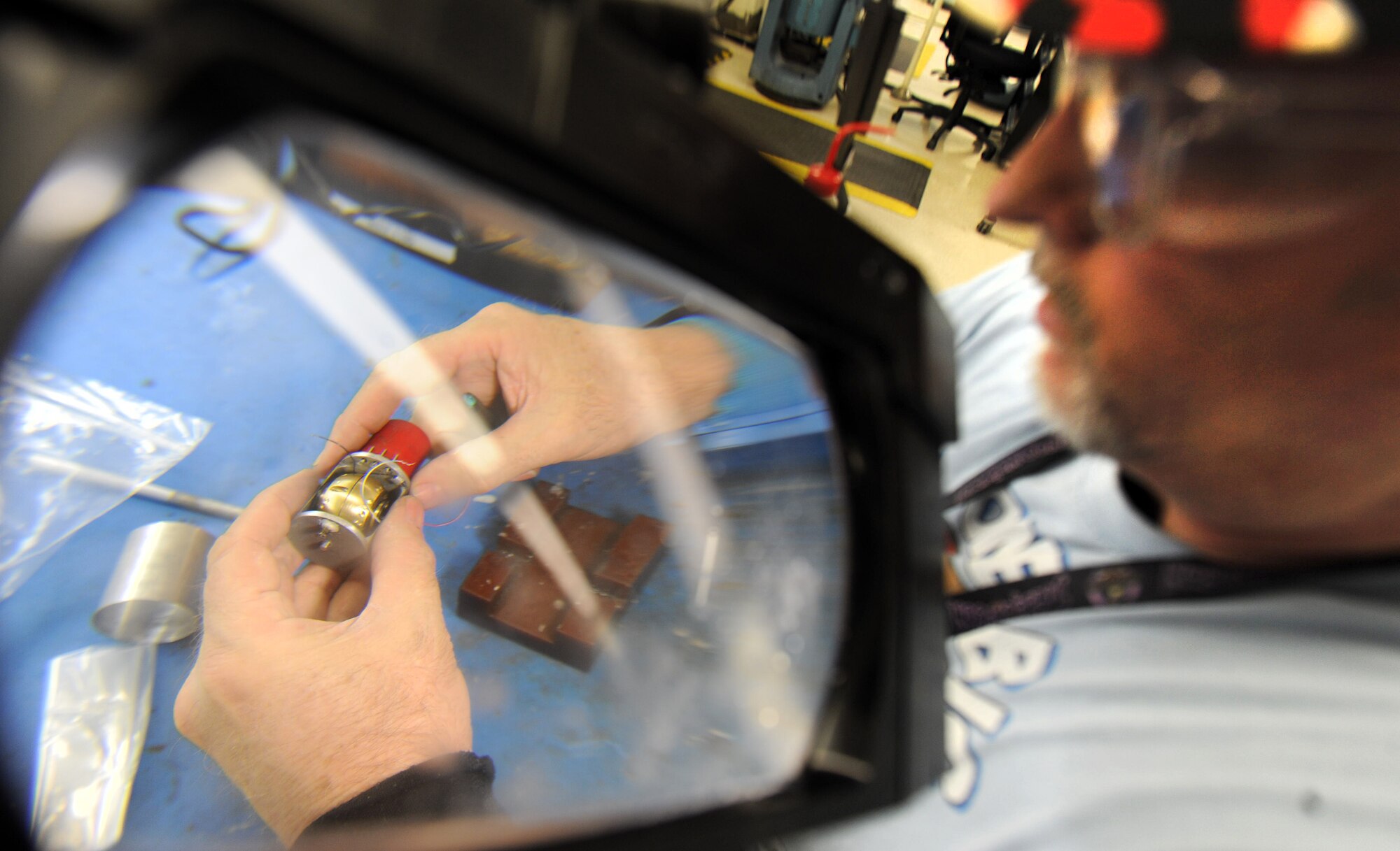 Ken Boyd, 566th Electronics Maintenance Squadron electronics worker, assembles a gyro motor and gimbal in preparation for installation into a sub-assembly. (U.S. Air Force photo by Tommie Horton)