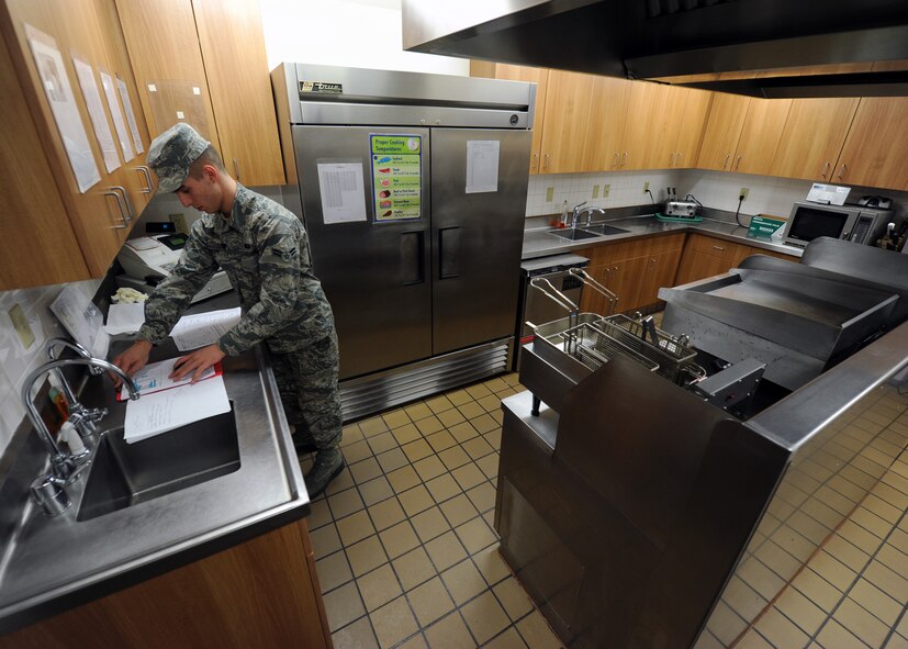 Airman 1st Class Brian Roupp, 341st Force Support Squadron missile chef, conducts changeover paperwork at the start of his tour at a missile alert facility. Missile chefs work alone, providing safe, quality food for maintainers, missileers and security forces members posted out to the missile field. (U.S. Air Force photo/Senior Airman Katrina Heikkinen)