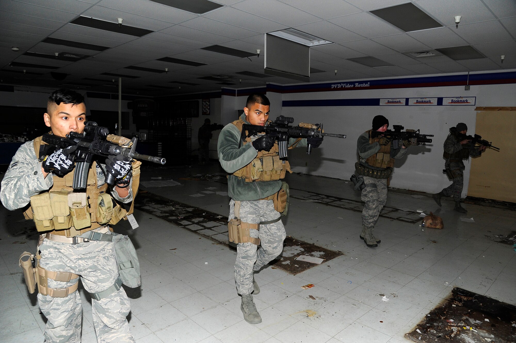 Members of the 341st Security Forces Group Tactical Response Force perform close quarter combat clearing exercise at the former Base Exchange at Malmstrom Air Force Base on March 17. TRF members perform annual close-quarter combat exercises to stay trained on specific tactics and maneuvers in preparation for real-world events. (U.S. Air Force photo/Airman 1st Class Collin Schmidt)