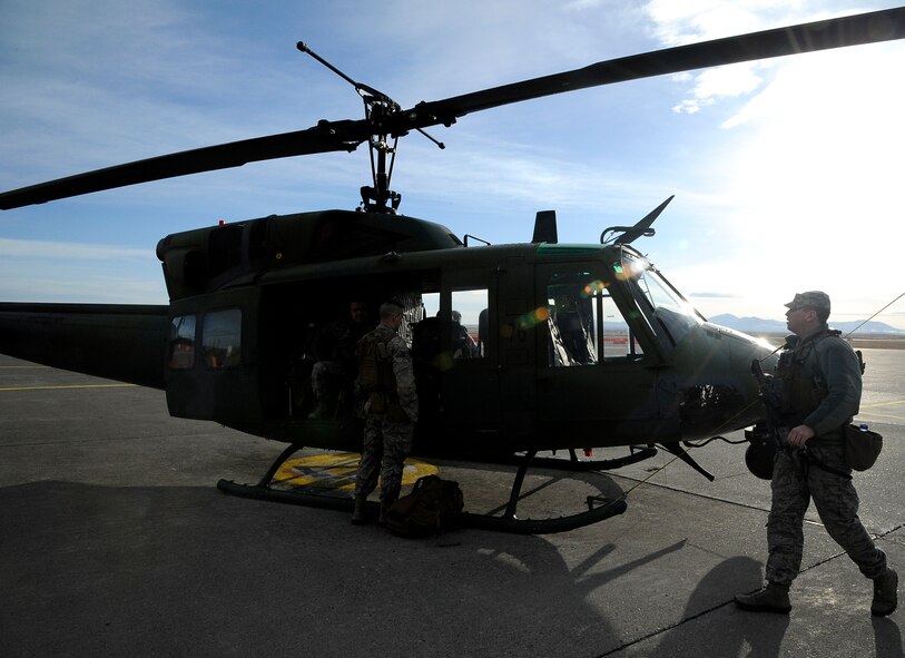 Members of the 341st Security Forces Group Tactical Response Force prepare for a flight in support of a convoy movement March 14. During the movement, TRF members provided over-watch of the convoy as additional support to the ground-based units. (U.S. Air Force photo/Airman 1st Class Collin Schmidt) 