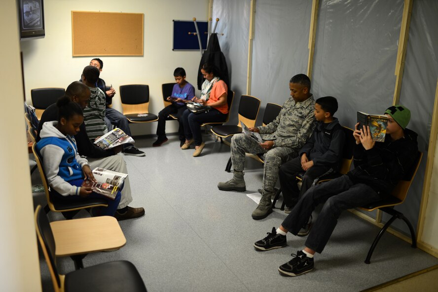 Members of the Spangdahlem community wait to be seen at a walk-in clinic for children event at Spangdahlem Air Base, Germany, March 21, 2014. The dental clinic expects to examine between 150 and 200 children throughout the day. (U.S. Air Force photo by Senior Airman Gustavo Castillo/Released)