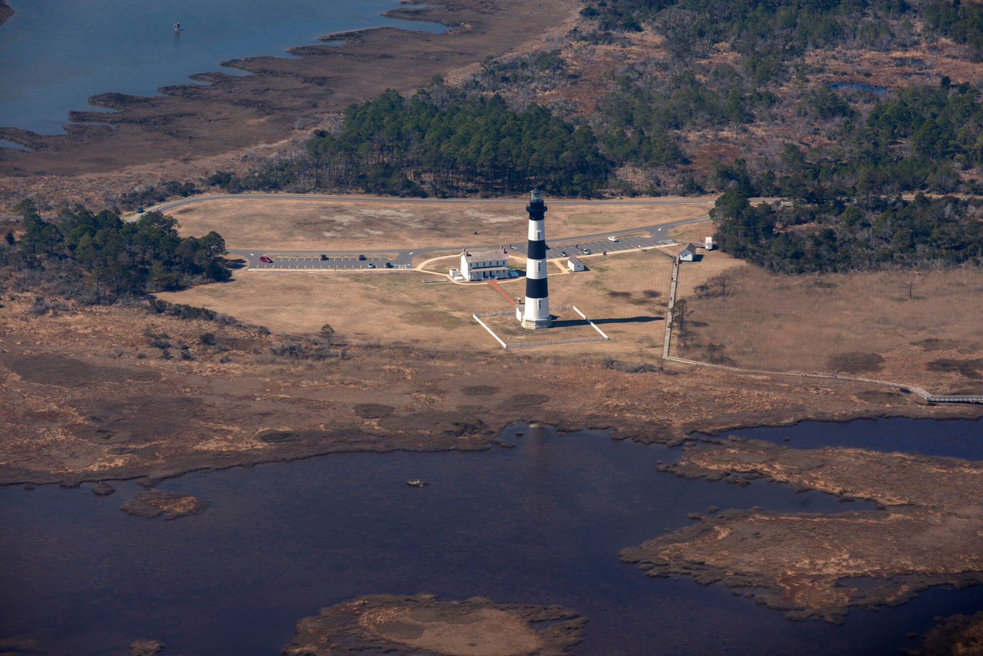 The Bodie Island lighthouse, as seen from the flight deck of a C-130H belonging to the 440th Airlift Wing, during a training flight for the Aeromedical Evacuation Squadron. The four hour flight originated at Pope Army Airfield and traveled along the North Carolina coast, Mar. 10, 2014 (photo by Lewis Perkins/Paraglide)