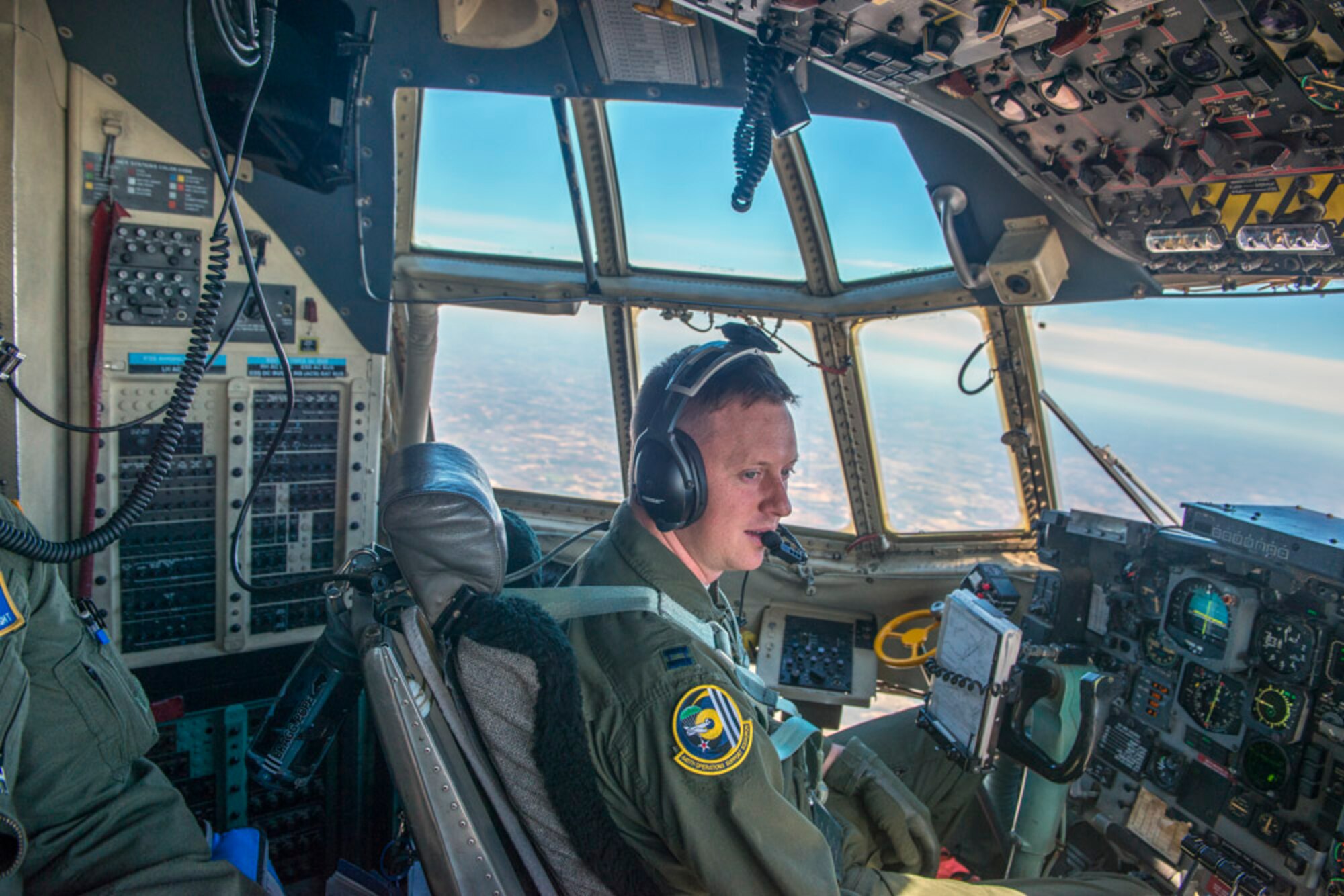 Capt. Eric O’Connor of the 95th Airlift Squadron pilots call sign “Duce 42”, a C-130H from the 440th Airlift Wing during the training flight Mar. 10, 2014 (photo by Lewis Perkins/Paraglide)